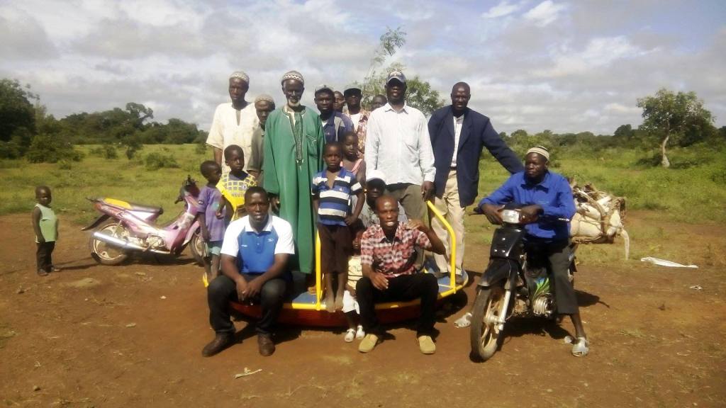EPI Employees George and Isaac with Empower Mali and community members and teachers from Ferekoroba