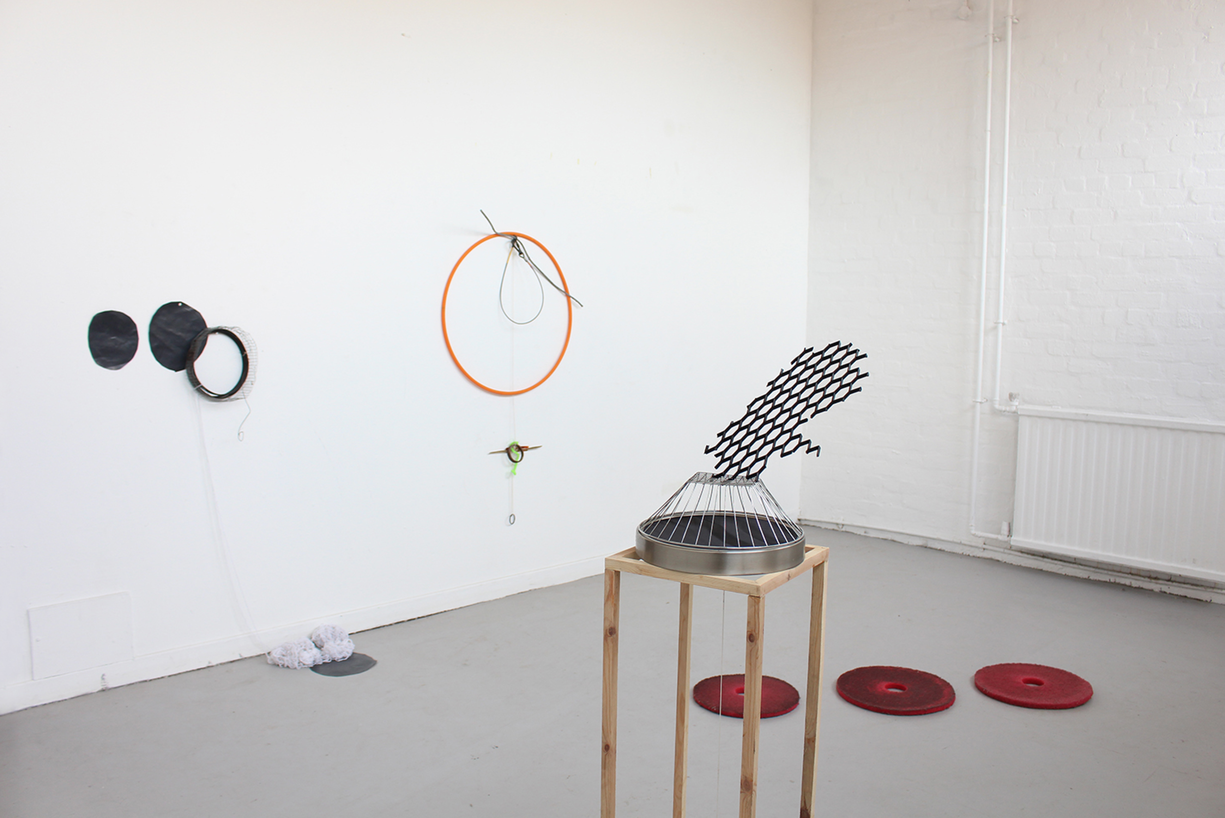 Circles connecting with collapsed time, mirror, broken glass fragments, half cut sign board, black sponge ball, plaster block, glass brick, hoop, etc, 2015 @DongKwang Jo