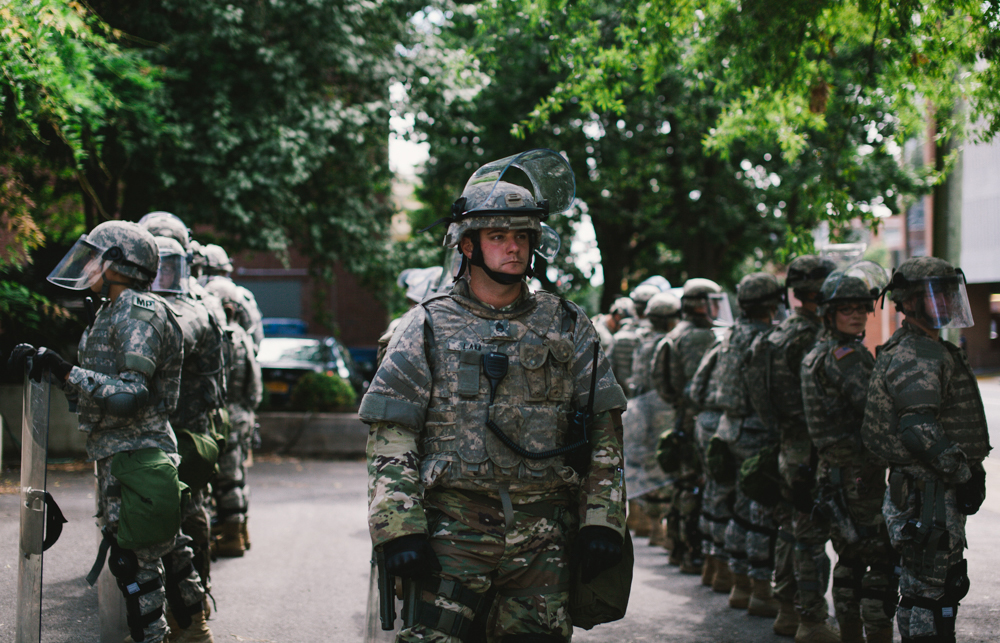 Members of a Virginia National Guard unit stand ready in Charlottesville. (Seth Herald / The Atlantic)