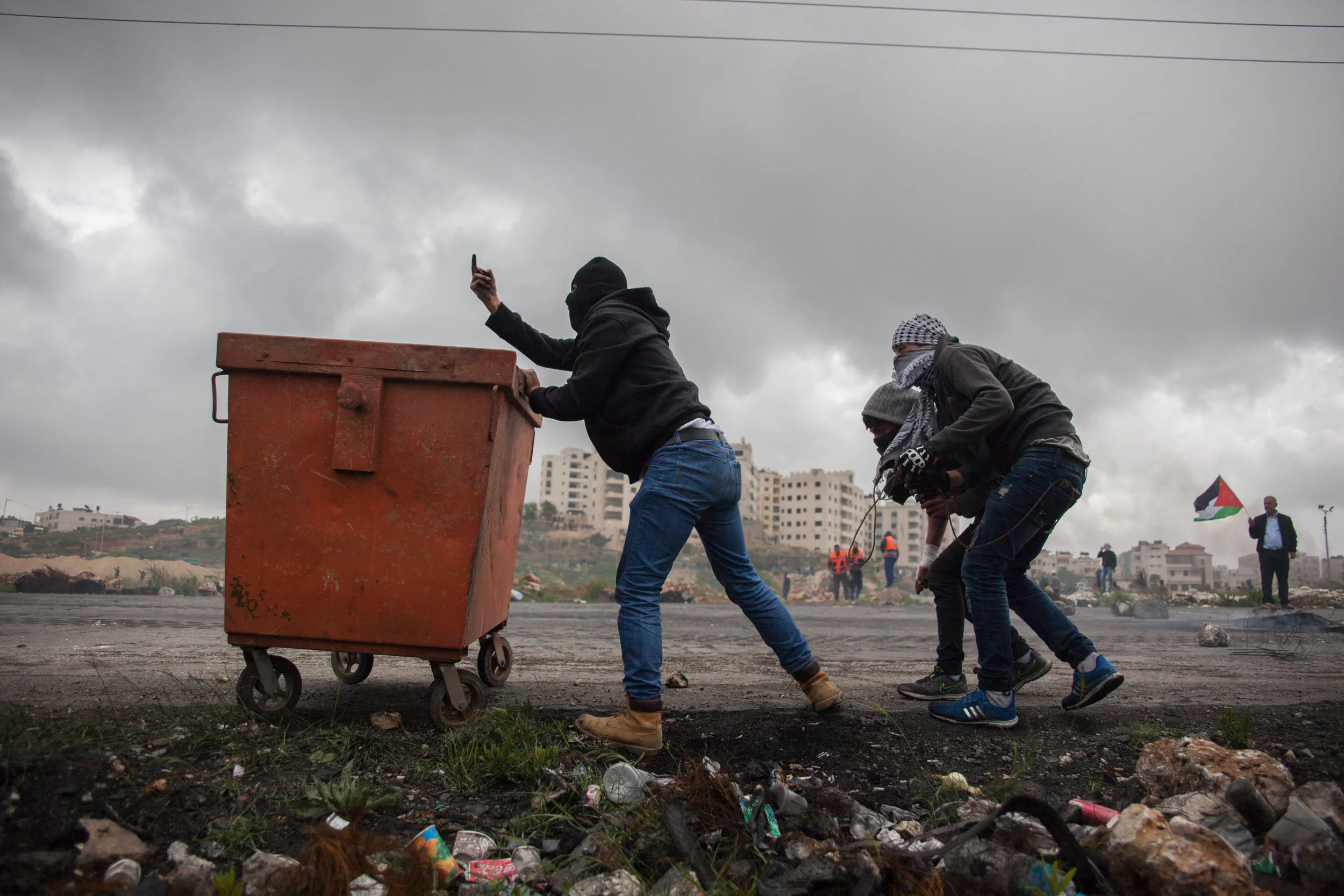 A Palestinian protester gestures to Israeli border police during Land Day protests near Beit El March 30, 2018 multiple people were injured during the protests. (Seth Herald/Redux)