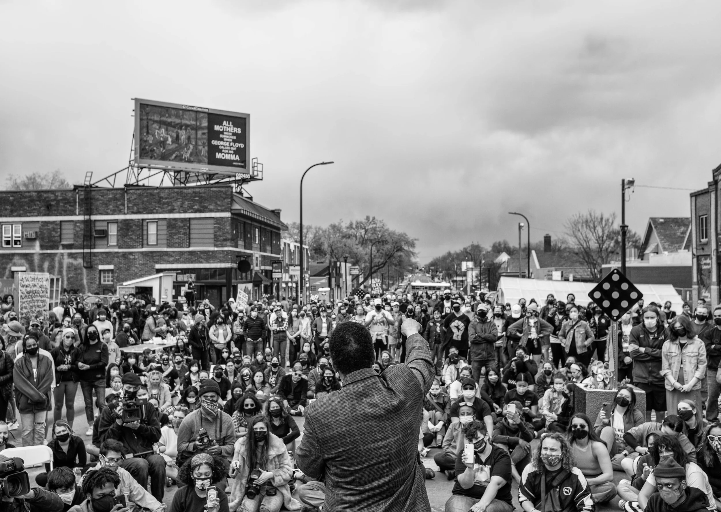  People gather at George Floyd Square Sunday, April 18,2021 during a rally that was planned by Asian and Black communities to protest the killing of Daunte Wright and and stand in solidarity against racism. Attorneys being their closing statements in