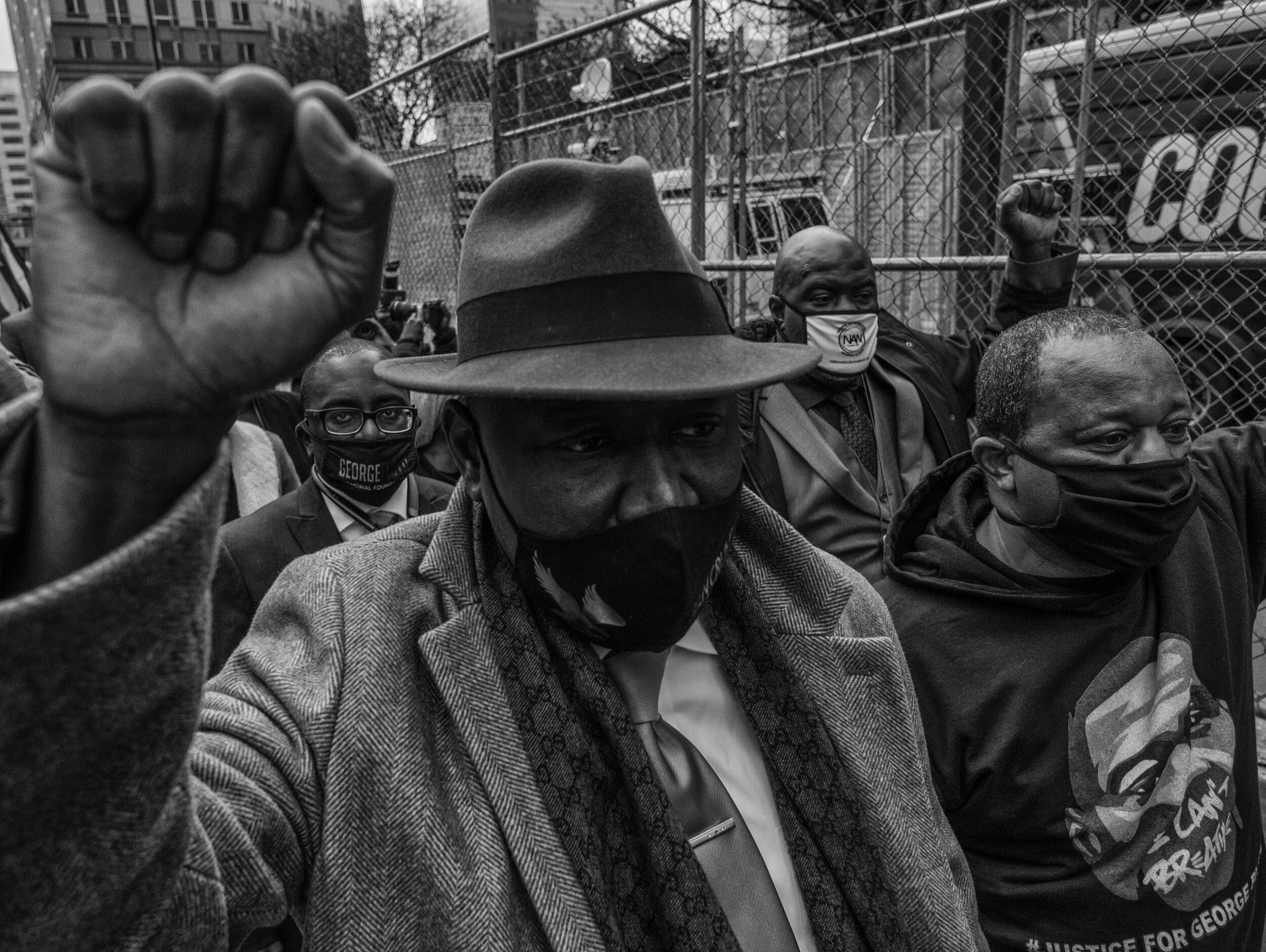  Civil rights attorney Benjamin Crump representing the Floyd and Wright families, and Rodney Floyd, brother of George Floyd hold their fists in the air after holding a press conference on April, 19,2021 outside of the Hennepin County Government Cente