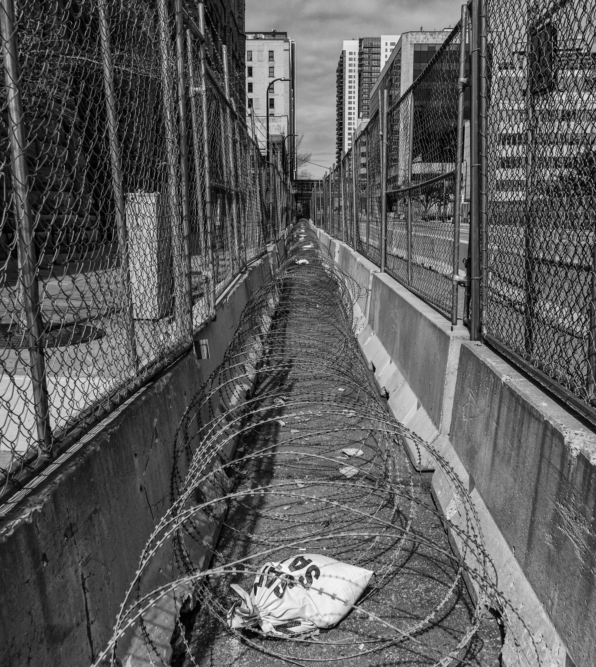  A fence barricade with razor-wire surrounds the Hennepin County Government Center where the Derek Chauvin trial is taking place in downtown Minneapolis, Minnesota, Saturday, April 17,2021.  (Seth Herald/Redux Pictures) 
