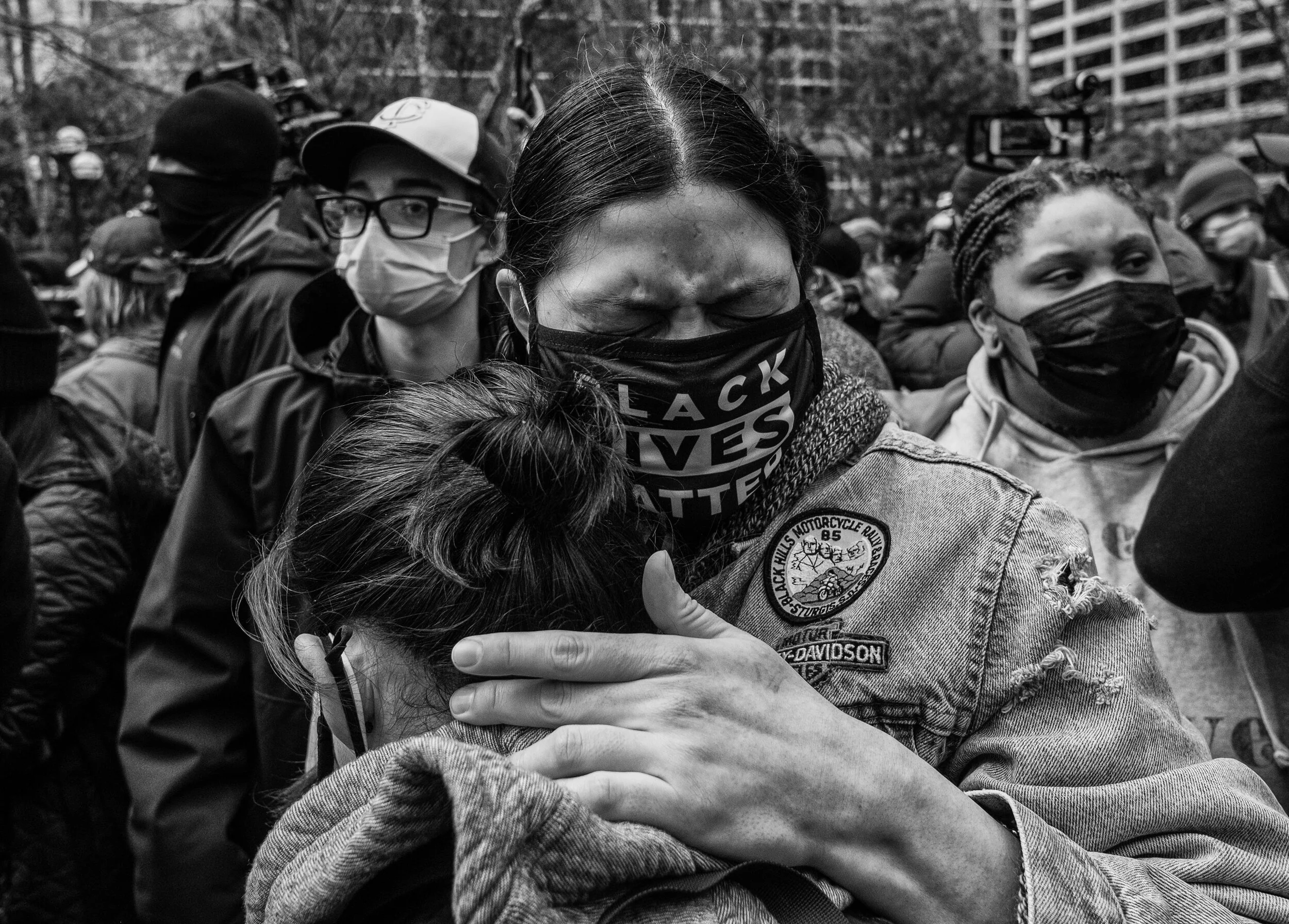  People embrace upon the announcement of the verdict for Derek Chauvin in downtown Minneapolis, Minnesota near the Hennepin county government center  April 20,2021 shortly after the verdict was read. Chauvin was charged guilty to all three counts.  (