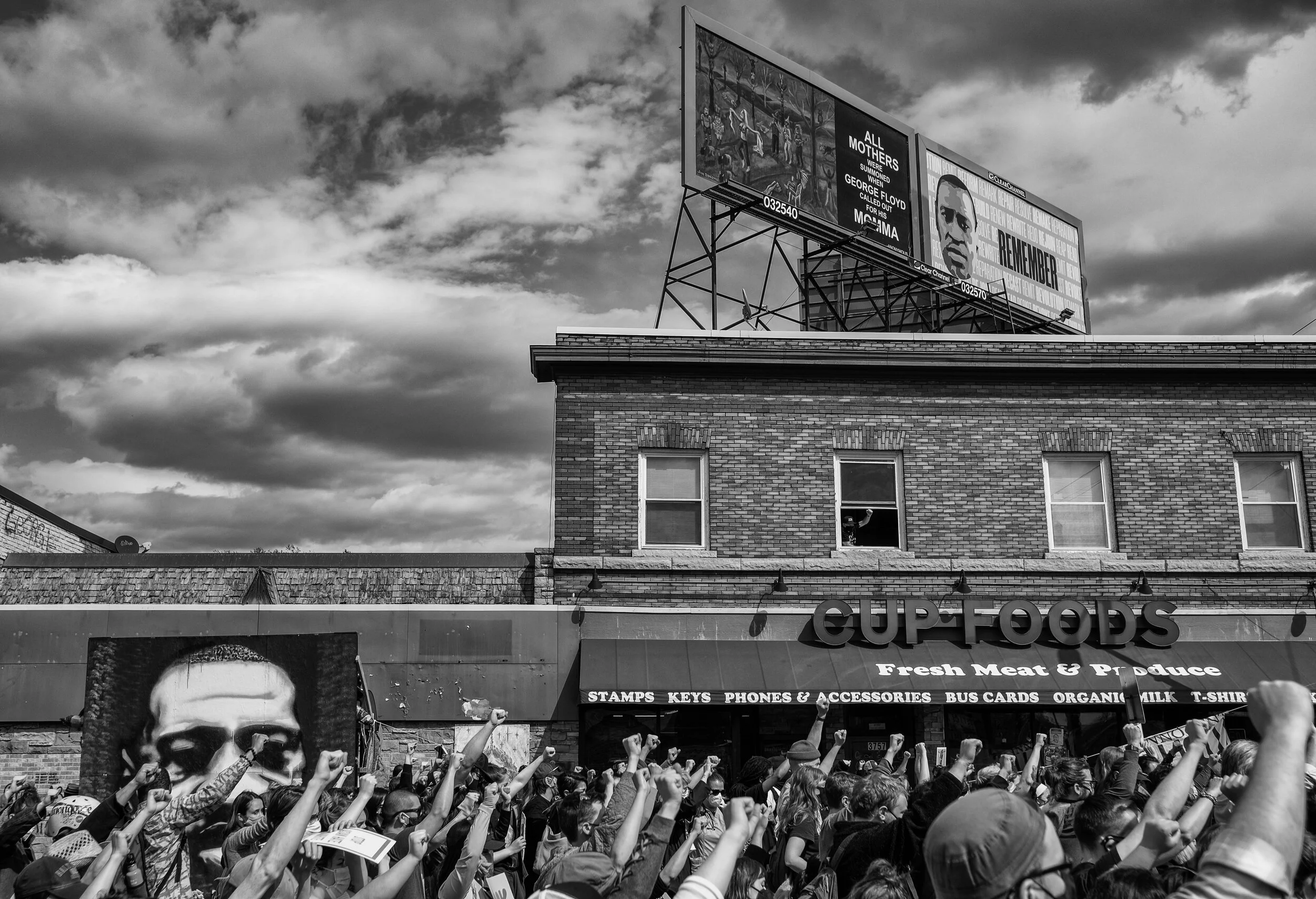 People gather at George Floyd Square Sunday, April 18,2021 during a rally that was planned by Asian and Black communities to protest the killing of Daunte Wright and and stand in solidarity against racism. Attorneys being their closing statements in