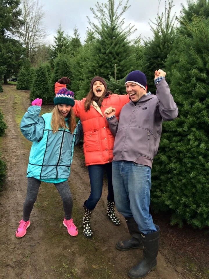 My niece, husband and I celebrate finding the perfect tree.