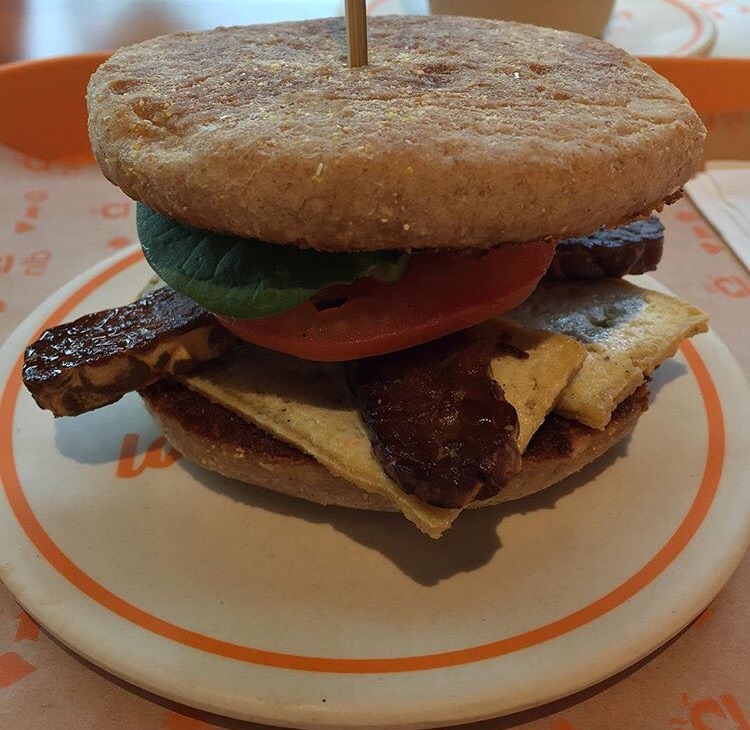 Whole wheat English muffin + tofu + tempeh bacon + lettuce + tomato = a yummy breakfast sandwich.