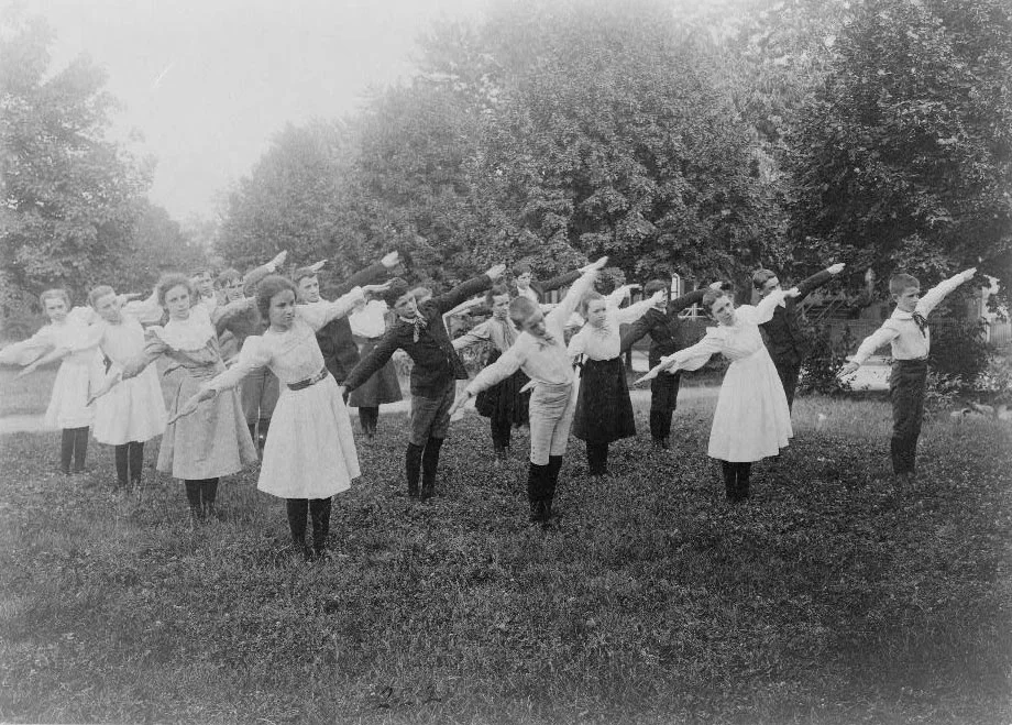 school kids exercising on lawn.jpg