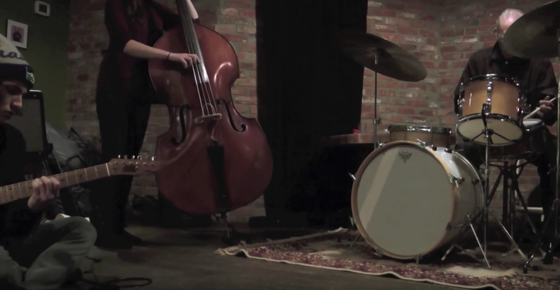 O’K obscured: L-R Ryan Beckley (guitar), Carmen Rothwell (bass), Gregg Keplinger (drums)