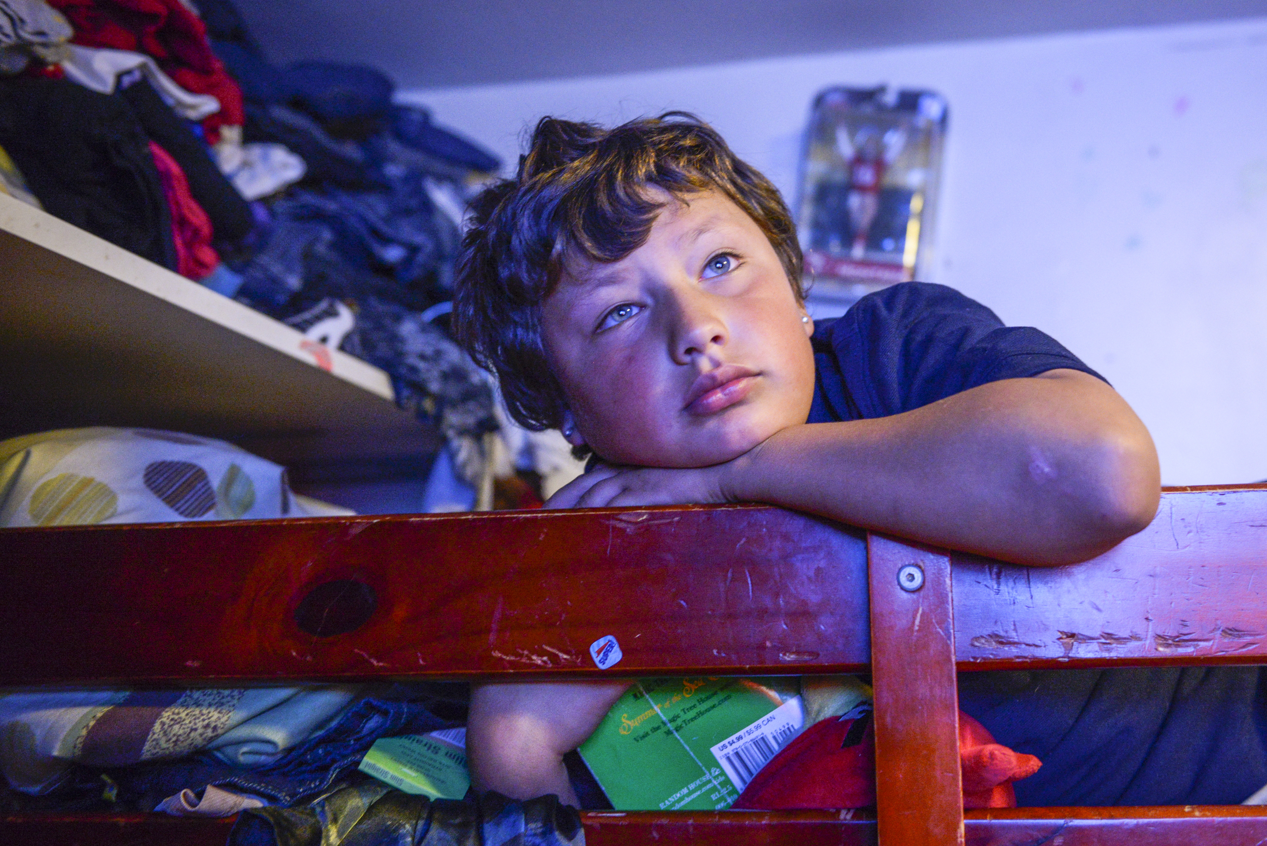  Christopher, 8, watches TV. He has been diagnosed with ADHD. 