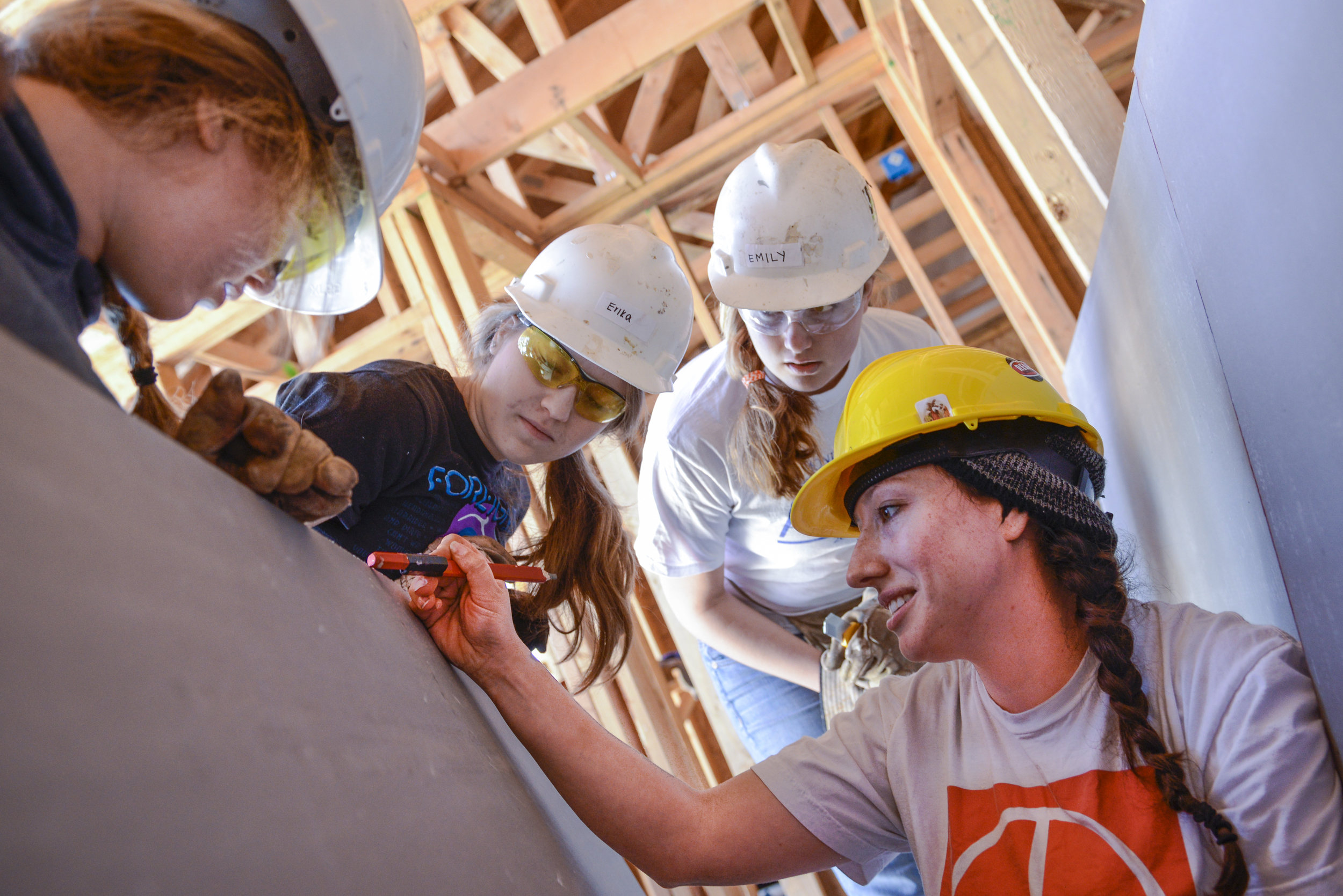 Amanda volunteers at a Habitat for Humanity Greater San Francisco building site to complete the 500 sweat equity hours that qualify as a down payment to purchase a Habitat for Humanity home. Habitat offers qualifying families 0% interest mortgages.