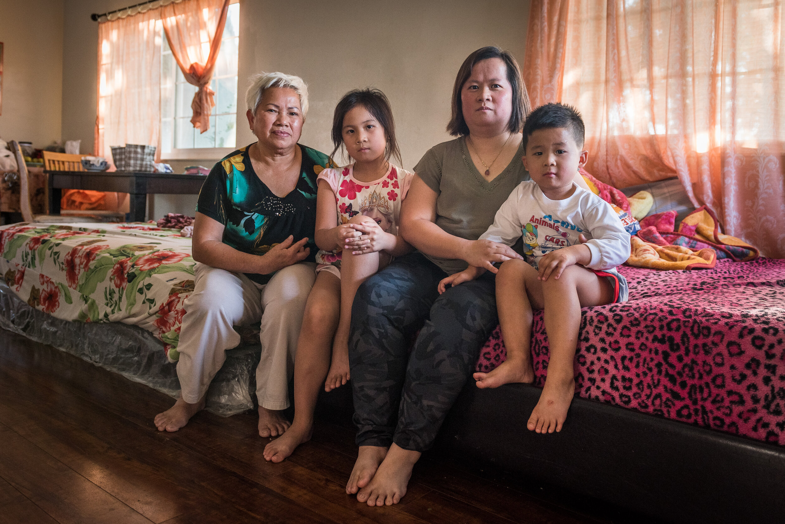  The Huynh Family: from left Van Doan, 68, Kate, 7, Angelha, 38, and Peter, 4. Angelha and her family live in an apartment in Rock Springs. “We had over 3 feet of water in the house. We had a lot of damage: clothes, shoes, TV, laptop. Everything on t