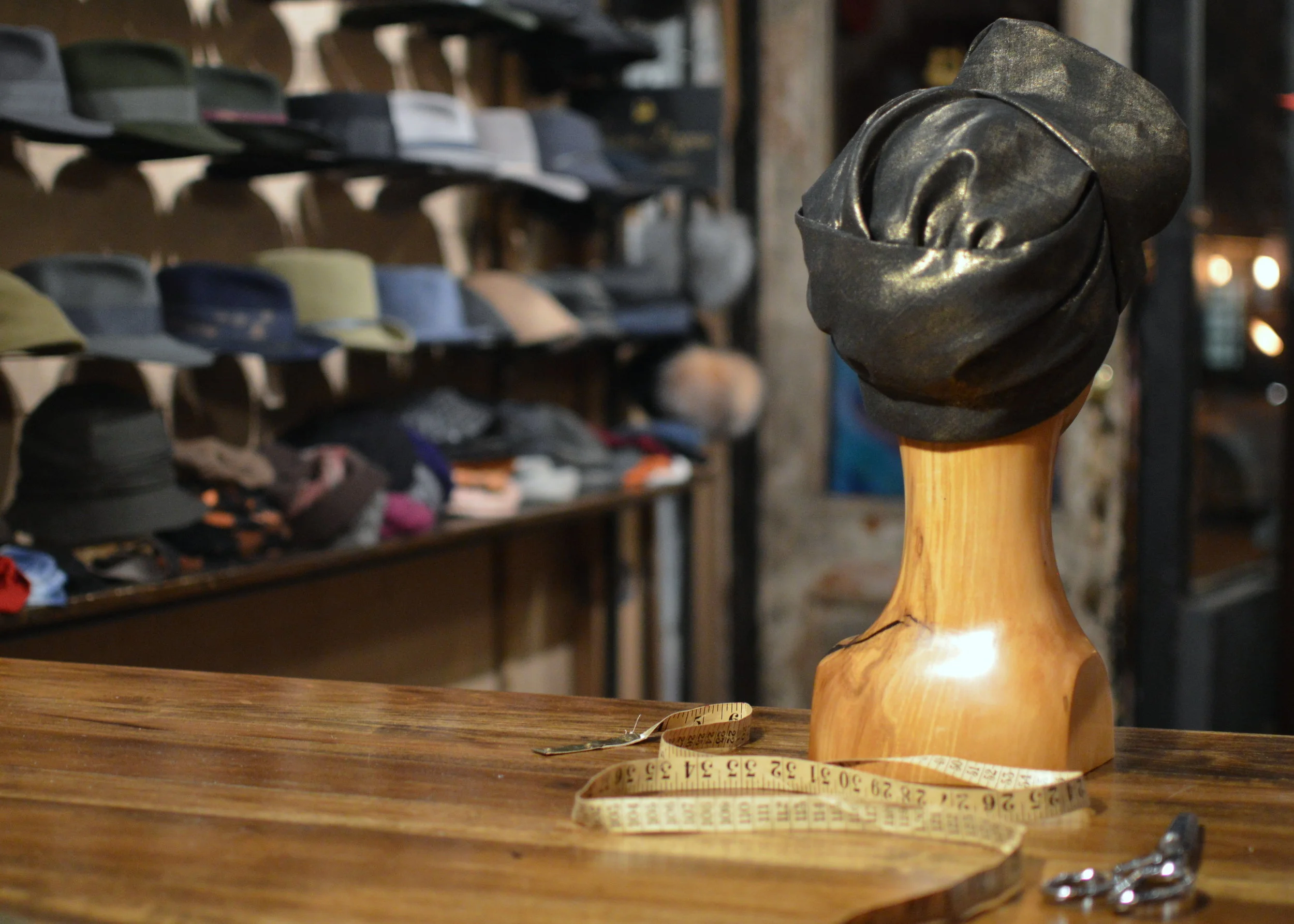 The Gold Linen Turban is hand draped in a luxurious material back