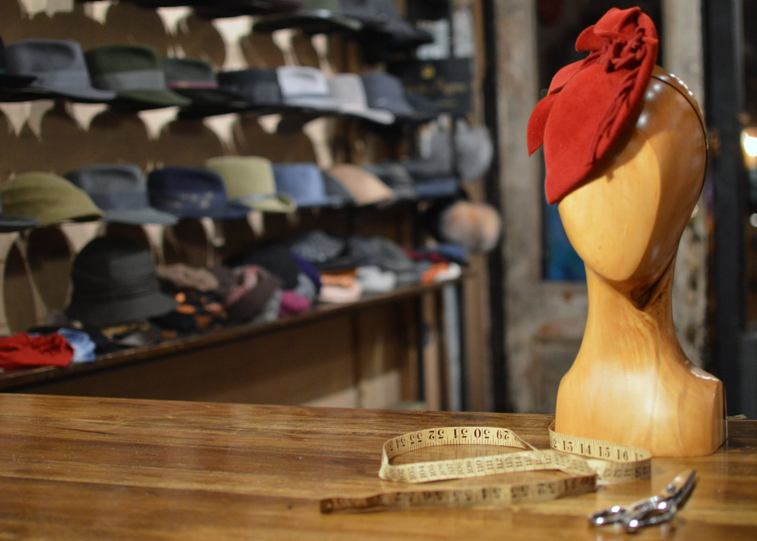 The Duchess in Scarlet is a fur felt cocktail hat with felt detail.