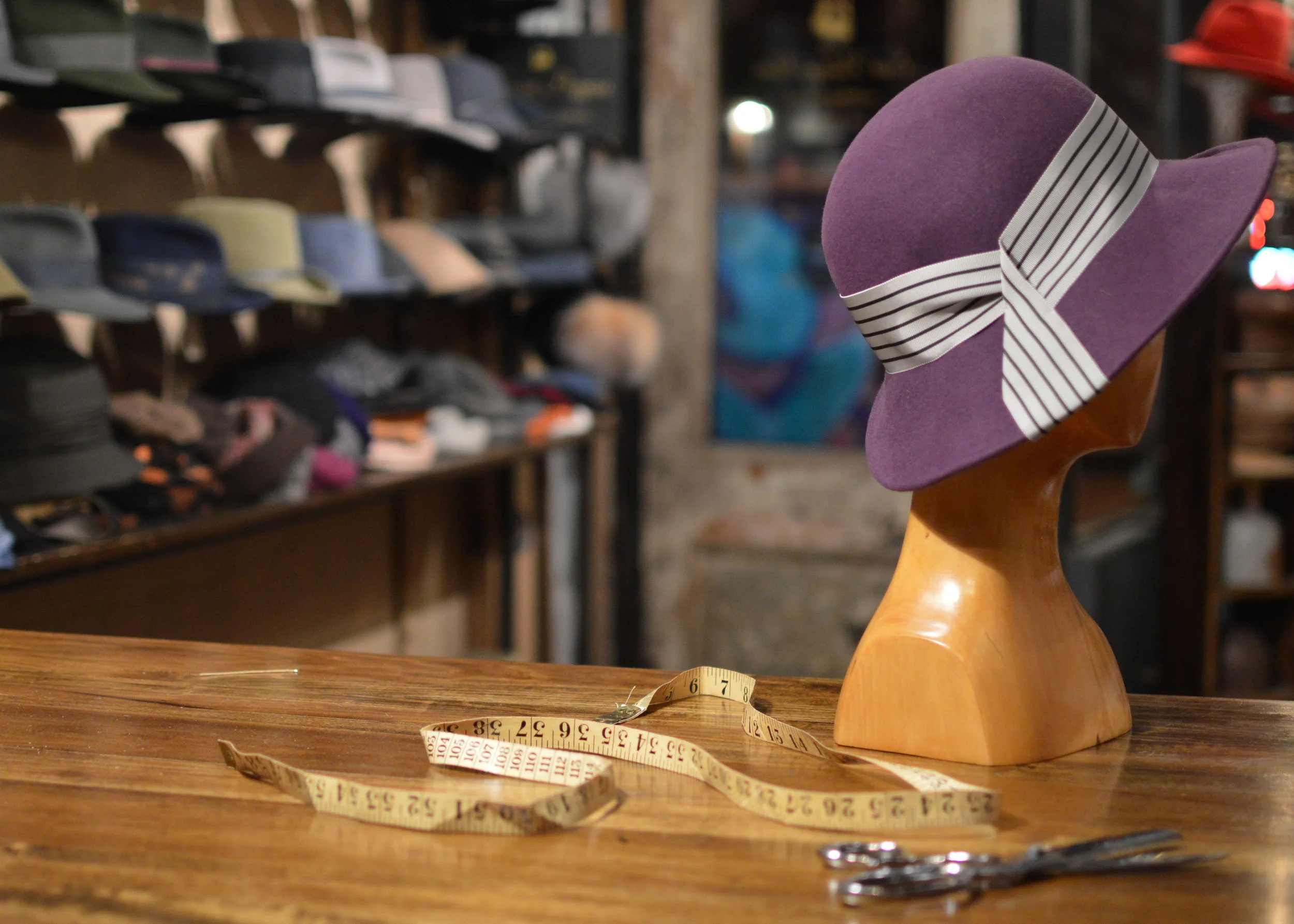 The Lady Mary in purple, with a striped ribbon trim, is an elegant hat option for your wardrobe
