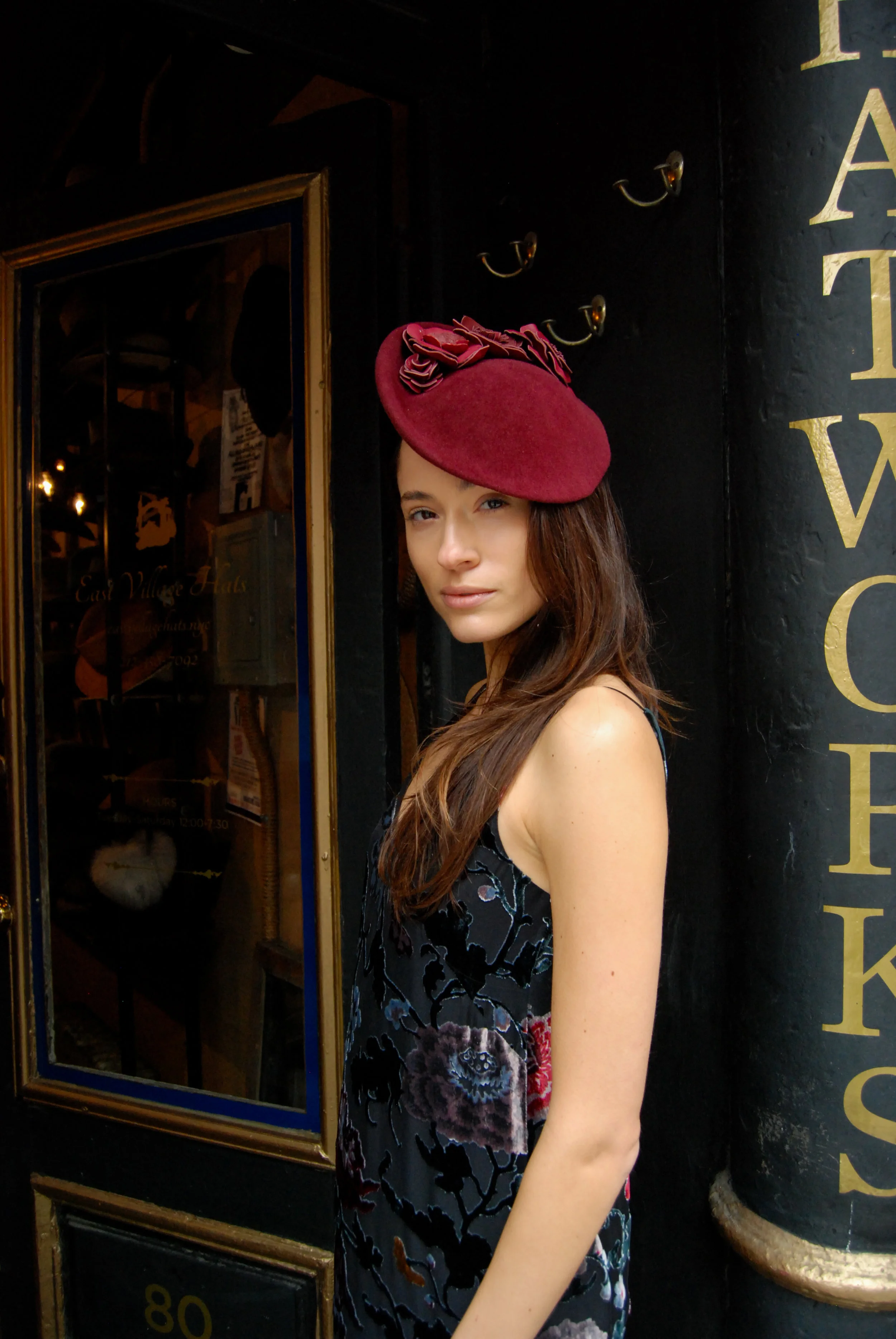 The Duchess in Scarlet is a fur felt cocktail hat with leather flower details