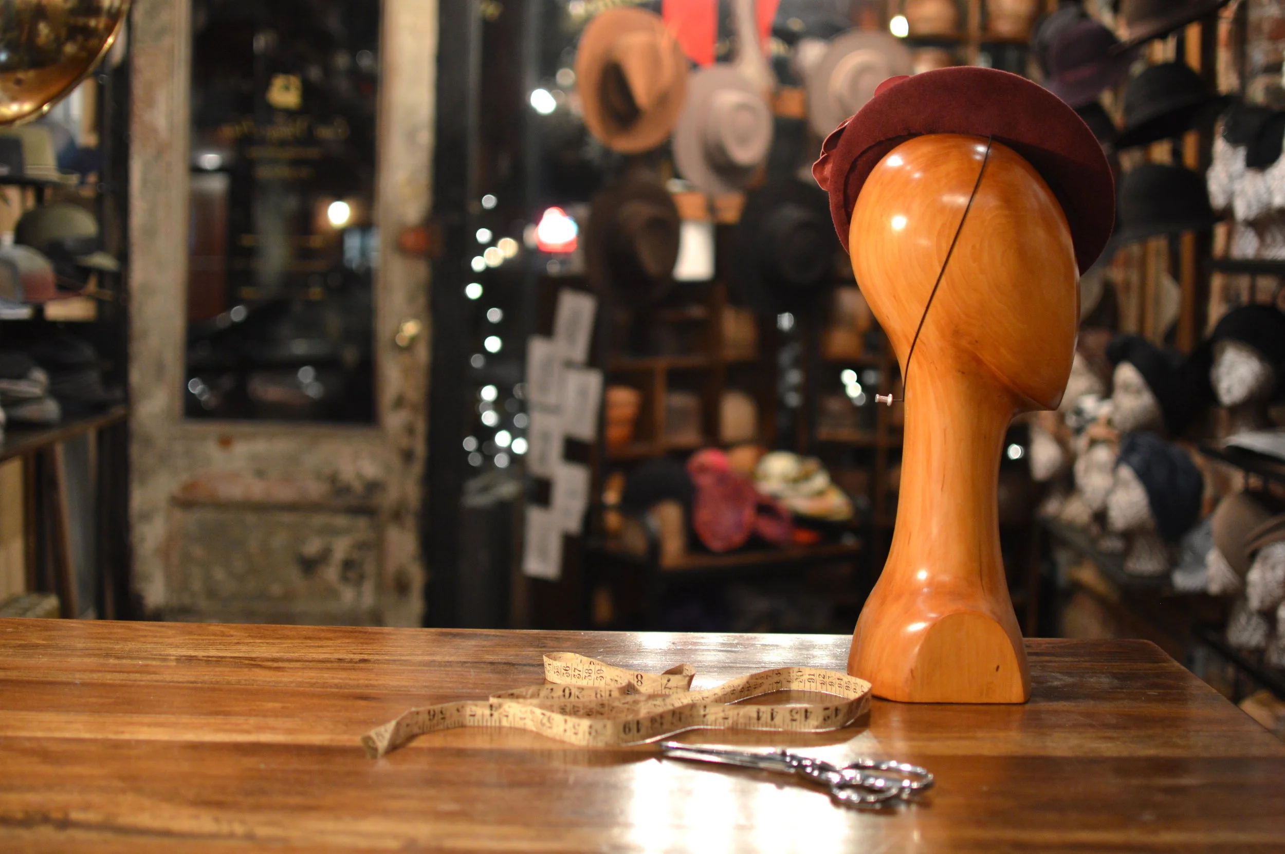 The Duchess in Scarlet is a fur felt cocktail hat with leather flower details