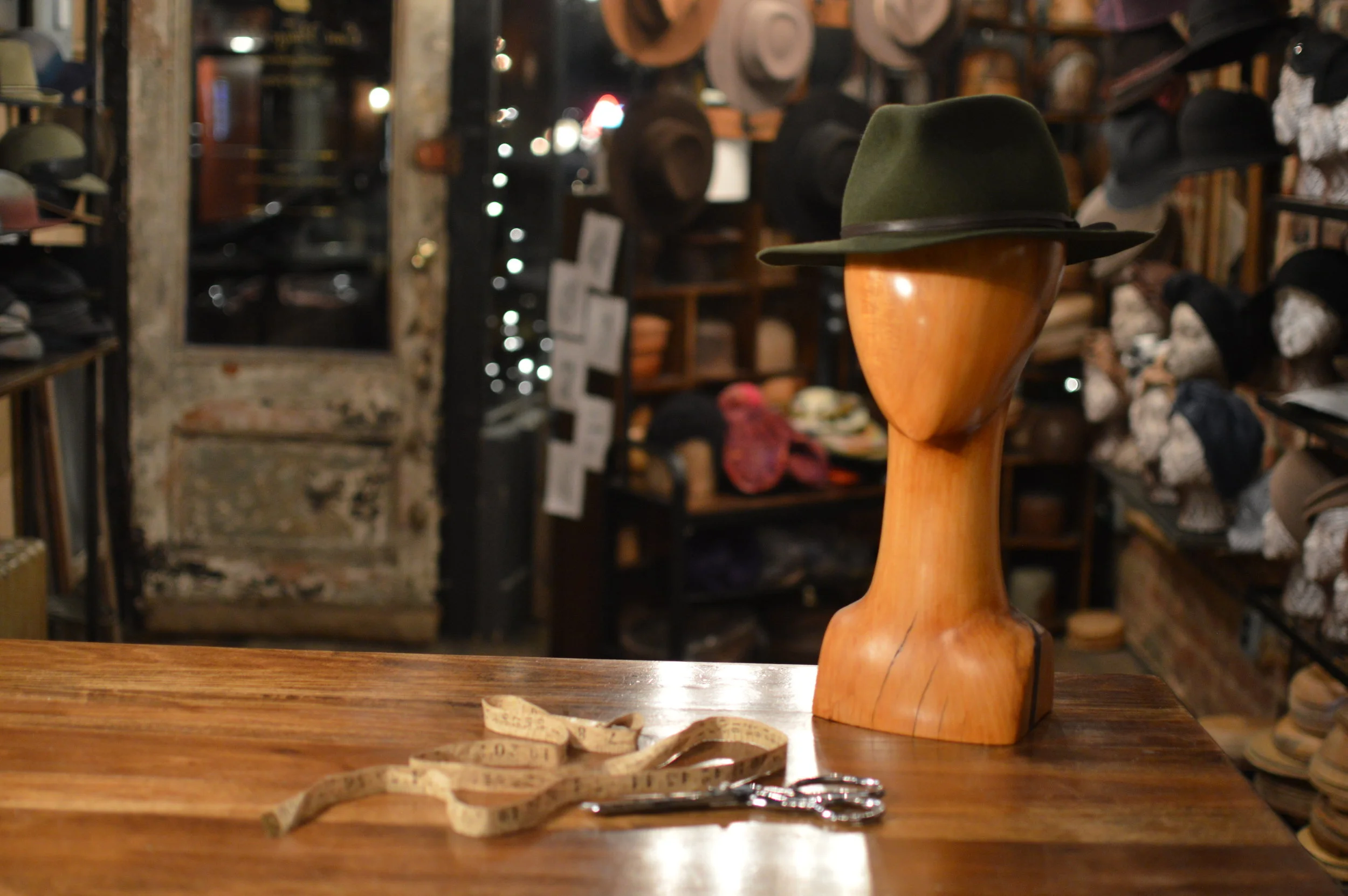 The Flat Clyde has a raw cut flat brimmed fedora handmade from Fur Felt  in rich green