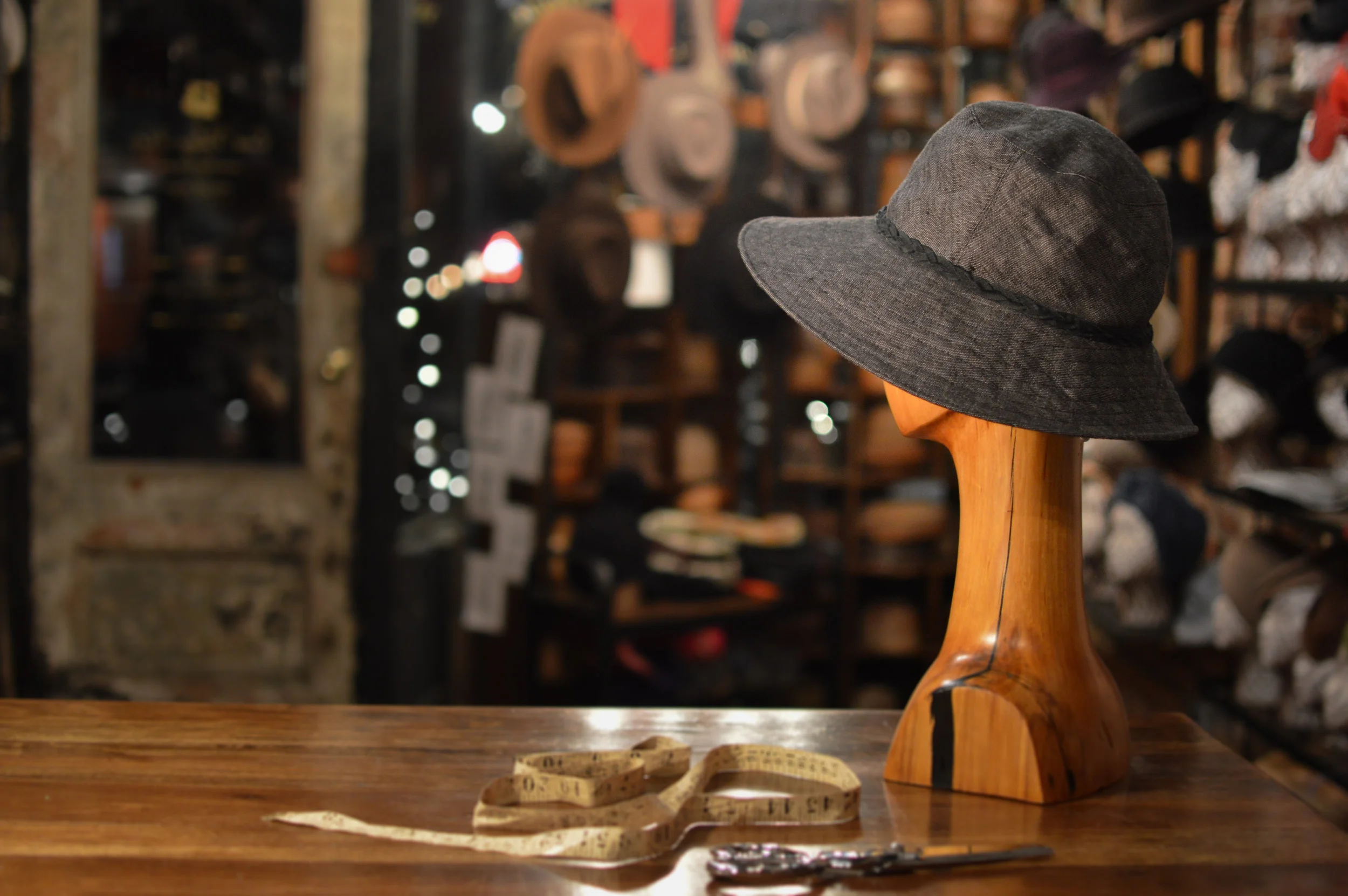 A Linen Summer Sun Hat in denim with braided trim by Laura Catignani side