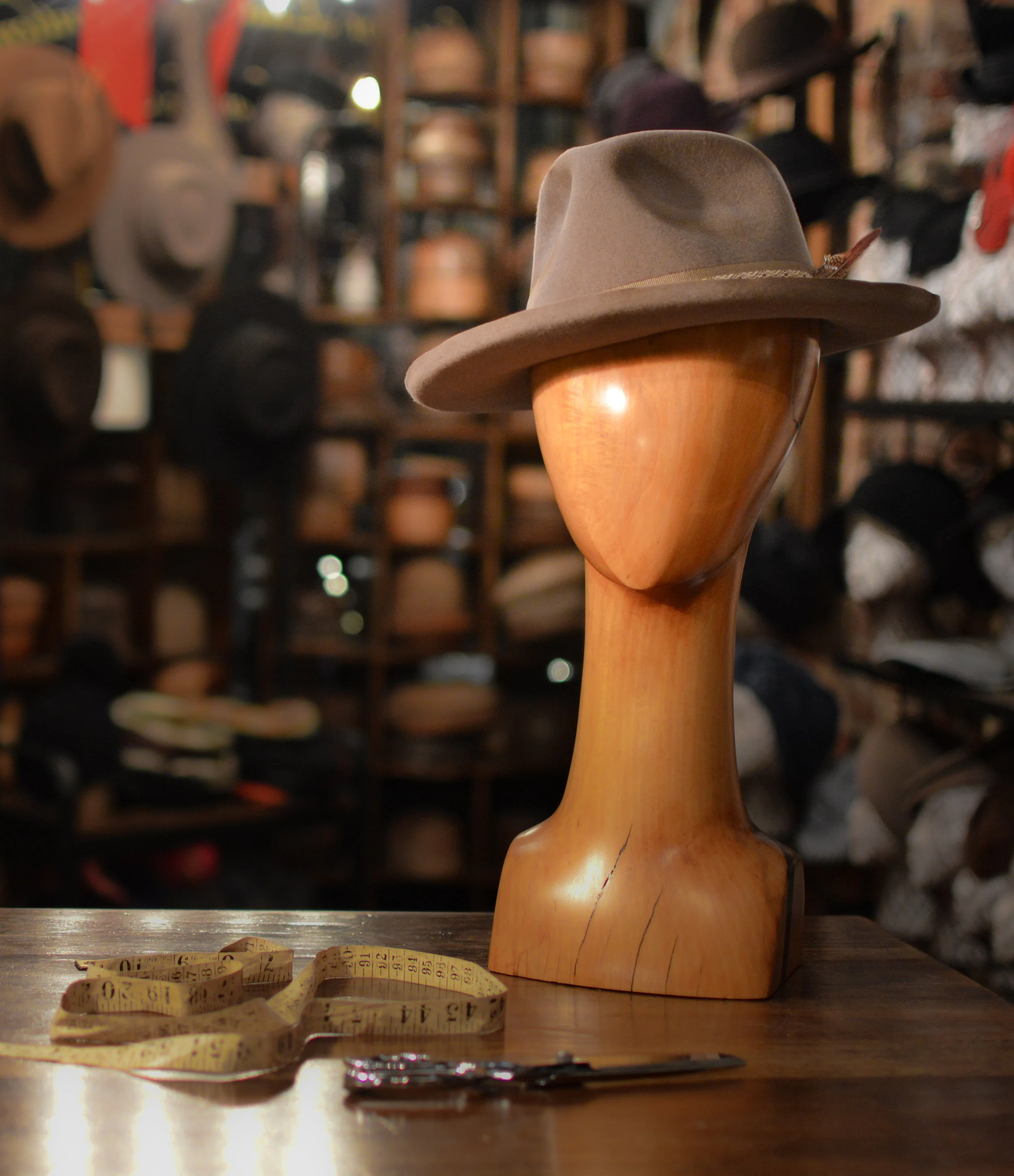 The Rustler in Mink - The Rustler has a 2 7/8 inch Kettle Curled Brim, with woven trim and feather.