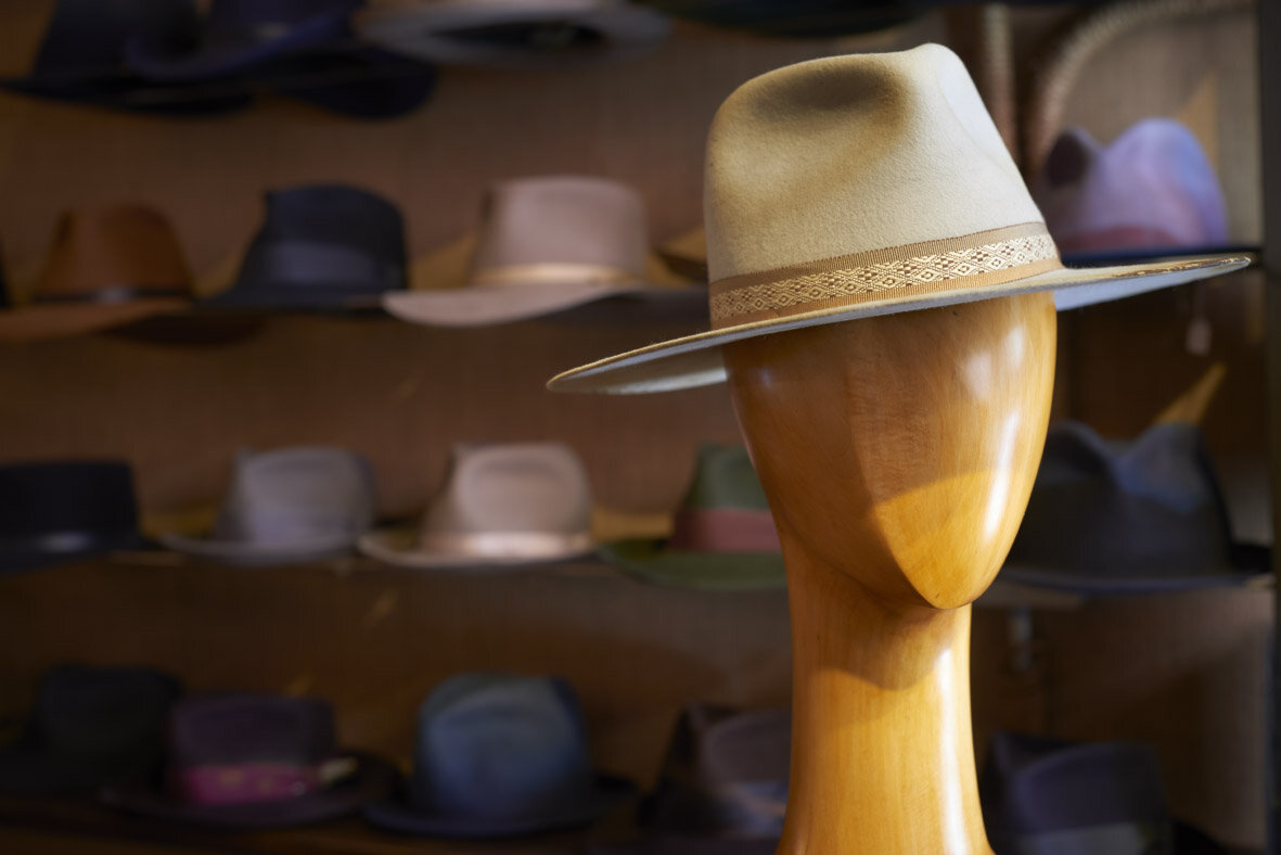 Austin Flat Brim Distressed Cowboy Hat in Alabaster with Woven Trim East Village Hats