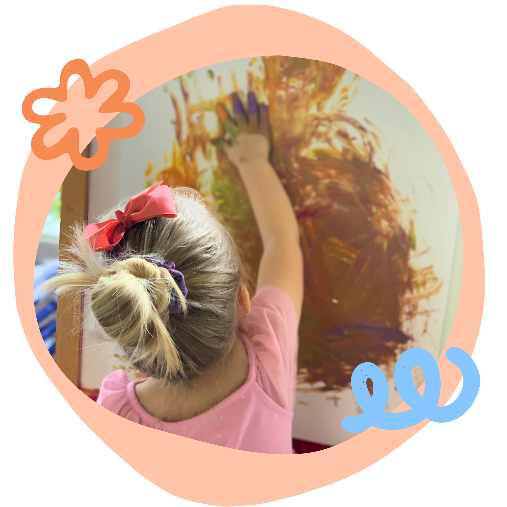 preschool girl painting with hands