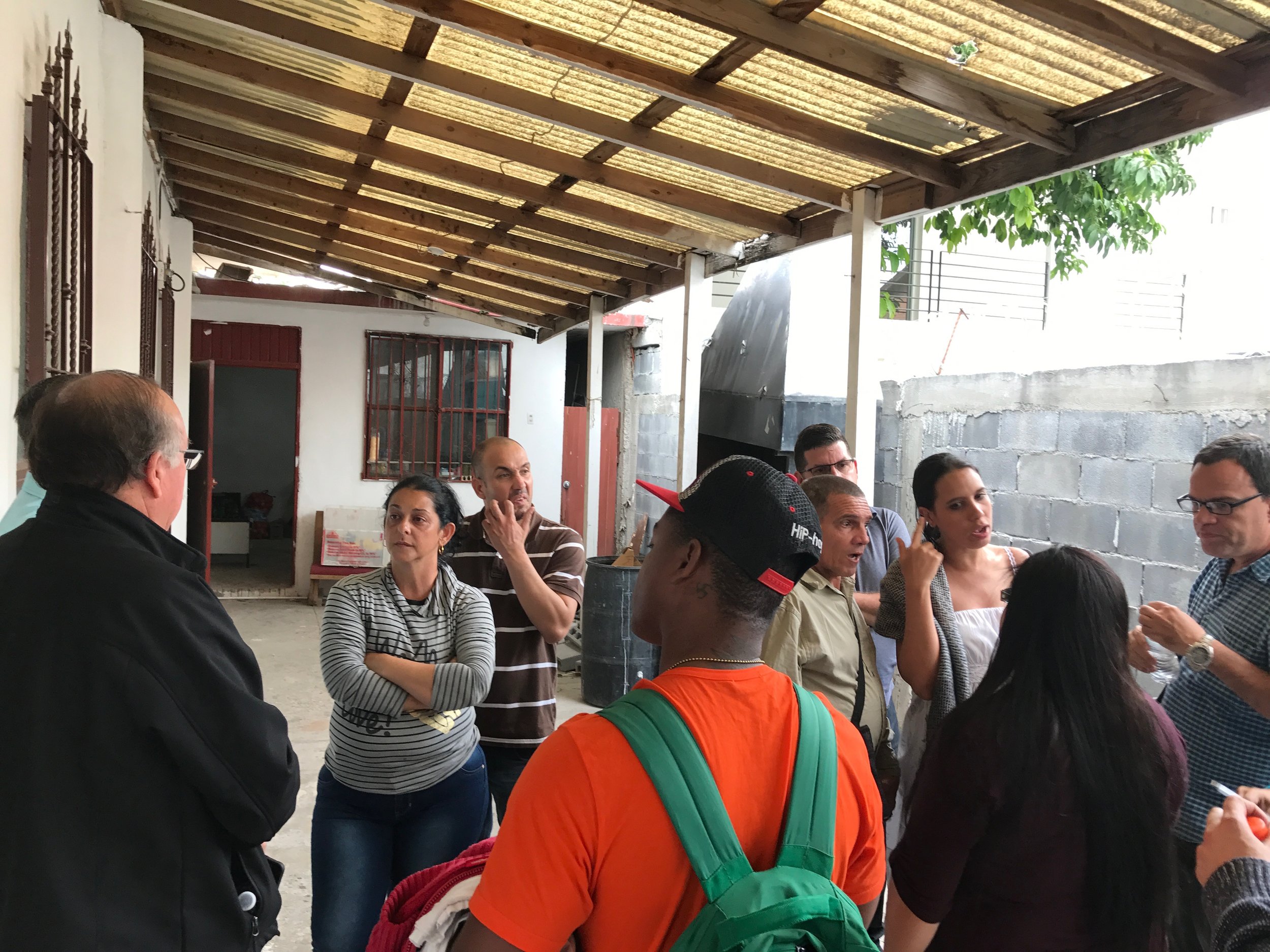  After unloading supplies at the church, the Cuban migrant community and Methodist and Baptists discuss the day’s activities. After this activity, some of the group went to visit with the local immigration and refugee services office to gain insight 