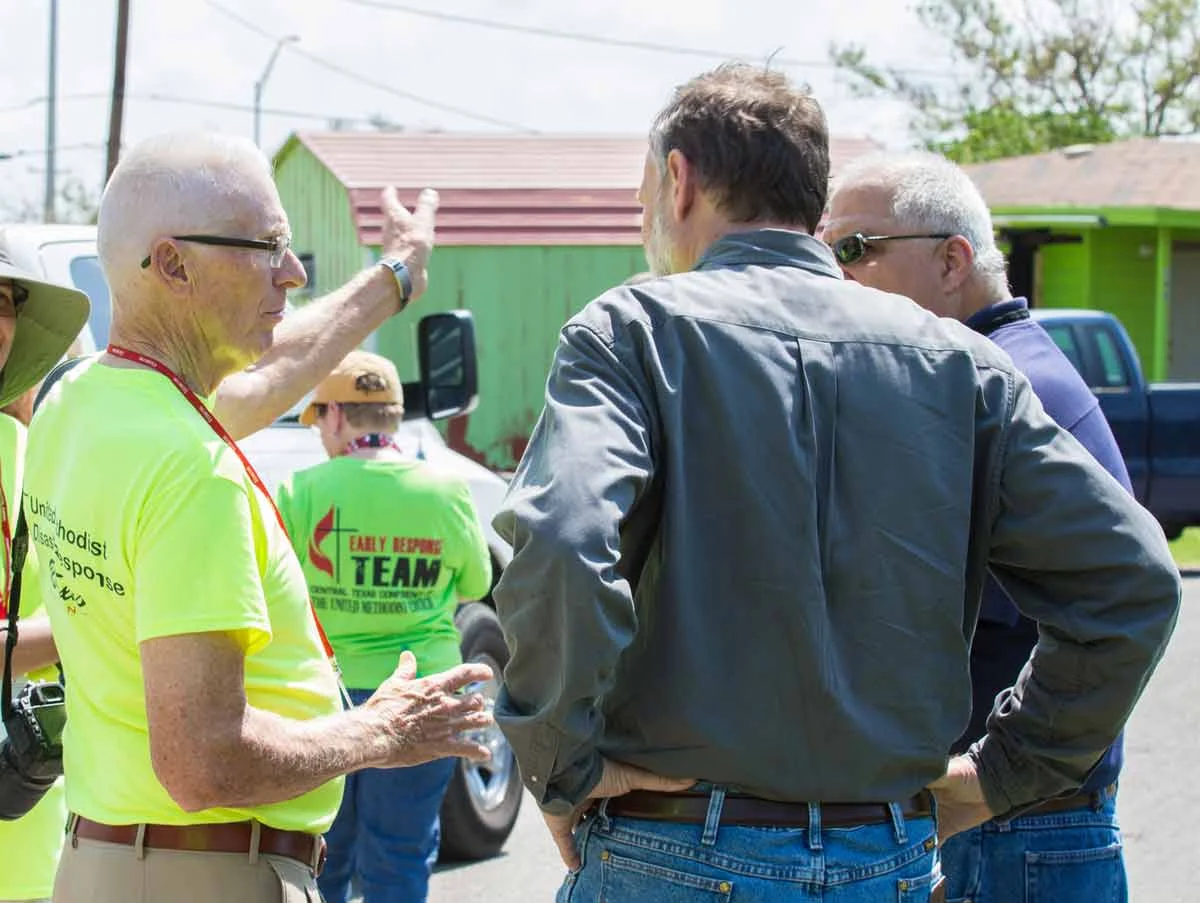 Disaster Response Coordinator Eugene Hileman briefs Robert Schnase on efforts on Gregory.
