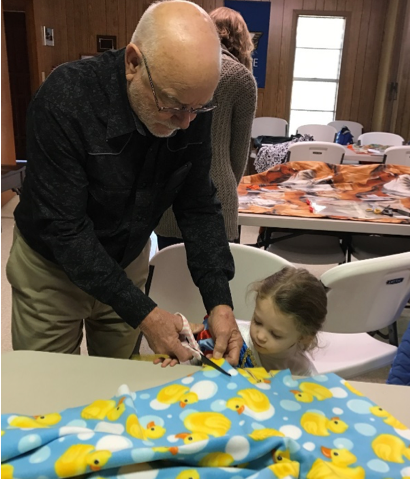  Lolita UMC cut fleece to make blankets for children in crisis. 