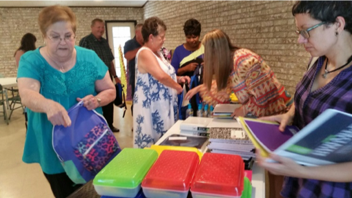  Point Comfort UMC fill backpacks with school supplies for local students. 