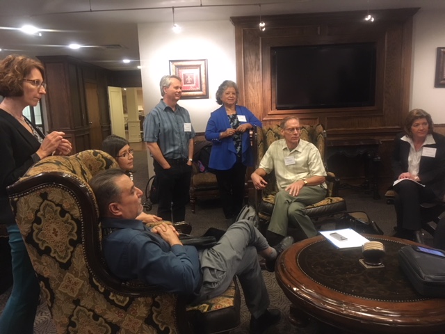 Members of the delegation gather for an informal meeting to discuss the sessions of the day.