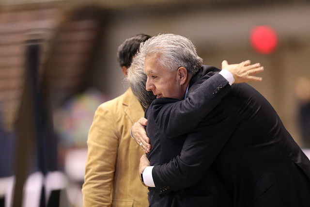 Bishop Robert Hoshibata embraces Bishop Ruben Saenz during the prayer time before Communion. Photo by Kathleen Barry, UMNS.Mawla Zothan