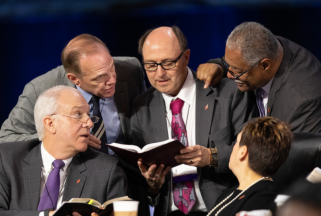 Bishops confer over the issue of whether the legislative committee can refer items to the denomination's Judicial Council for review during the 2019 United Methodist General Conference. Clockwise from lower left are: Thomas Bickerton, John Shcol