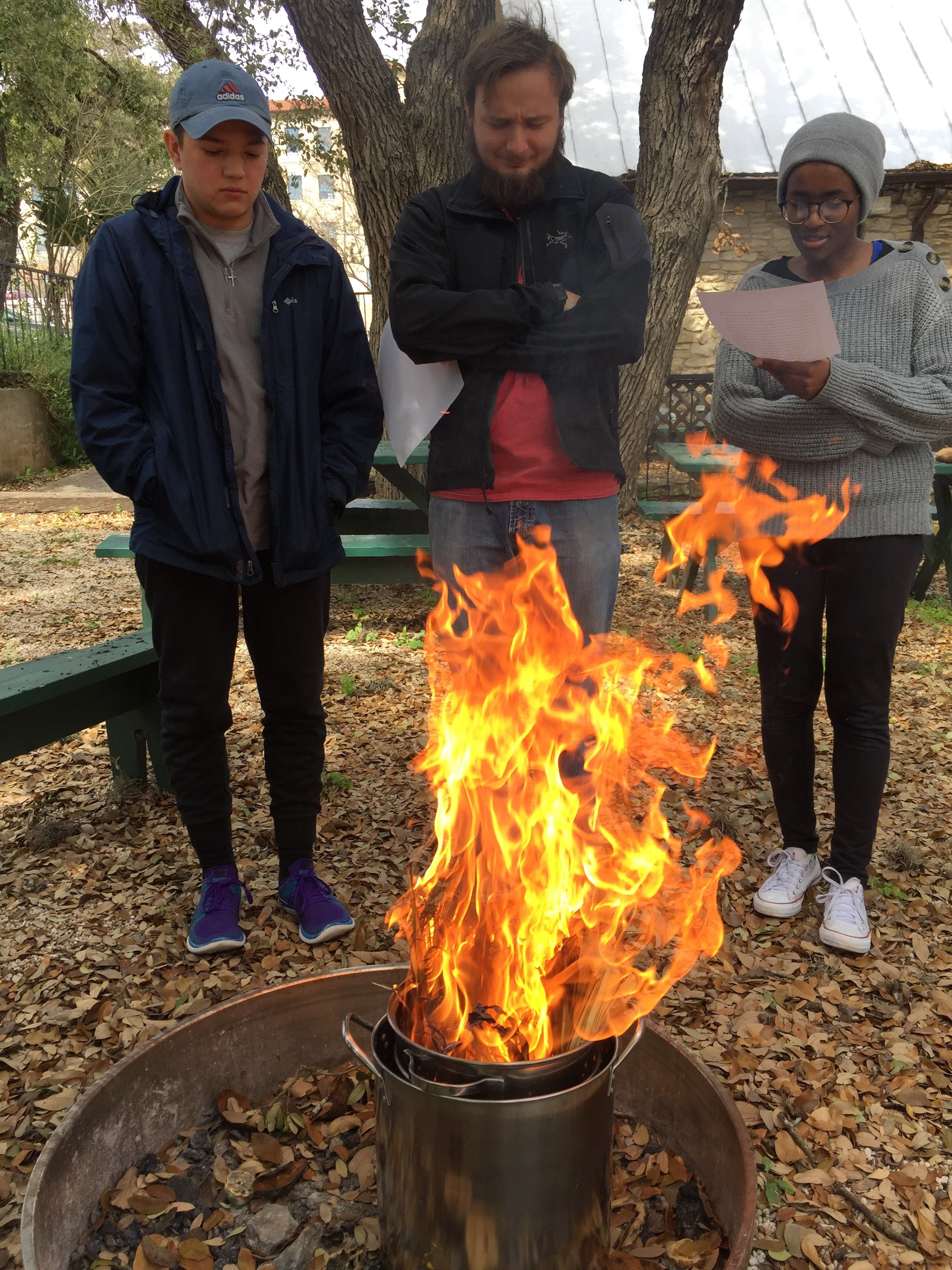  Texas State UCM students Evan Perez, Walker Metyko, and Consolatrice Nzoya prepare ashes from last year’s palms. 