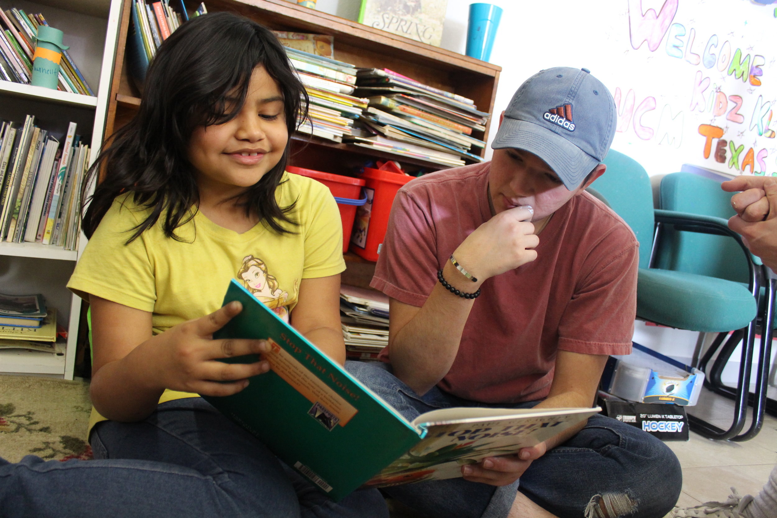  Texas State education student Evan Perez reads with an elementary student. Photos by Consolatrice Nzoya 