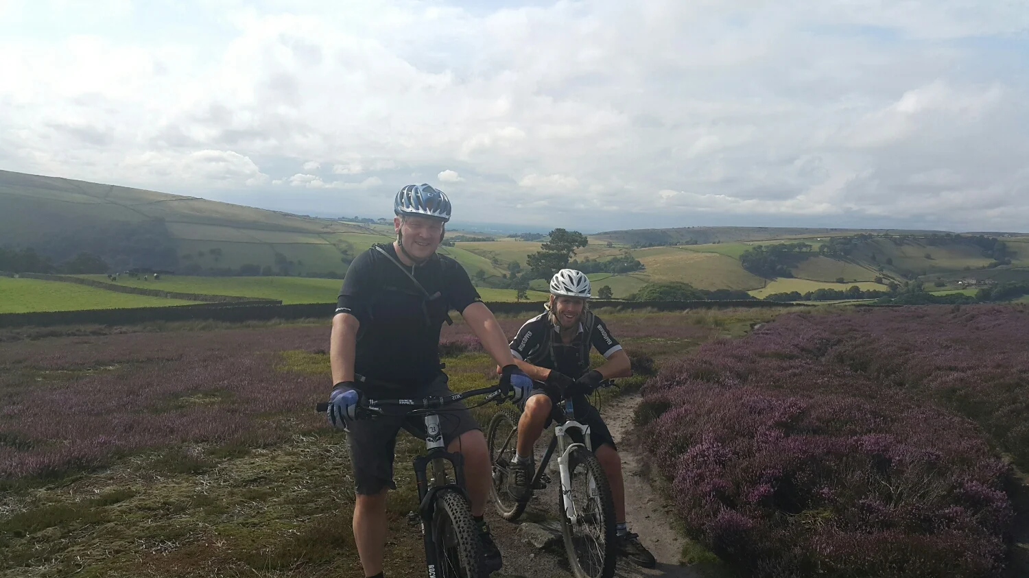 Dave and Pete with the purple flowers out on the Heather. The heather only flowers for a couple of weeks a year.