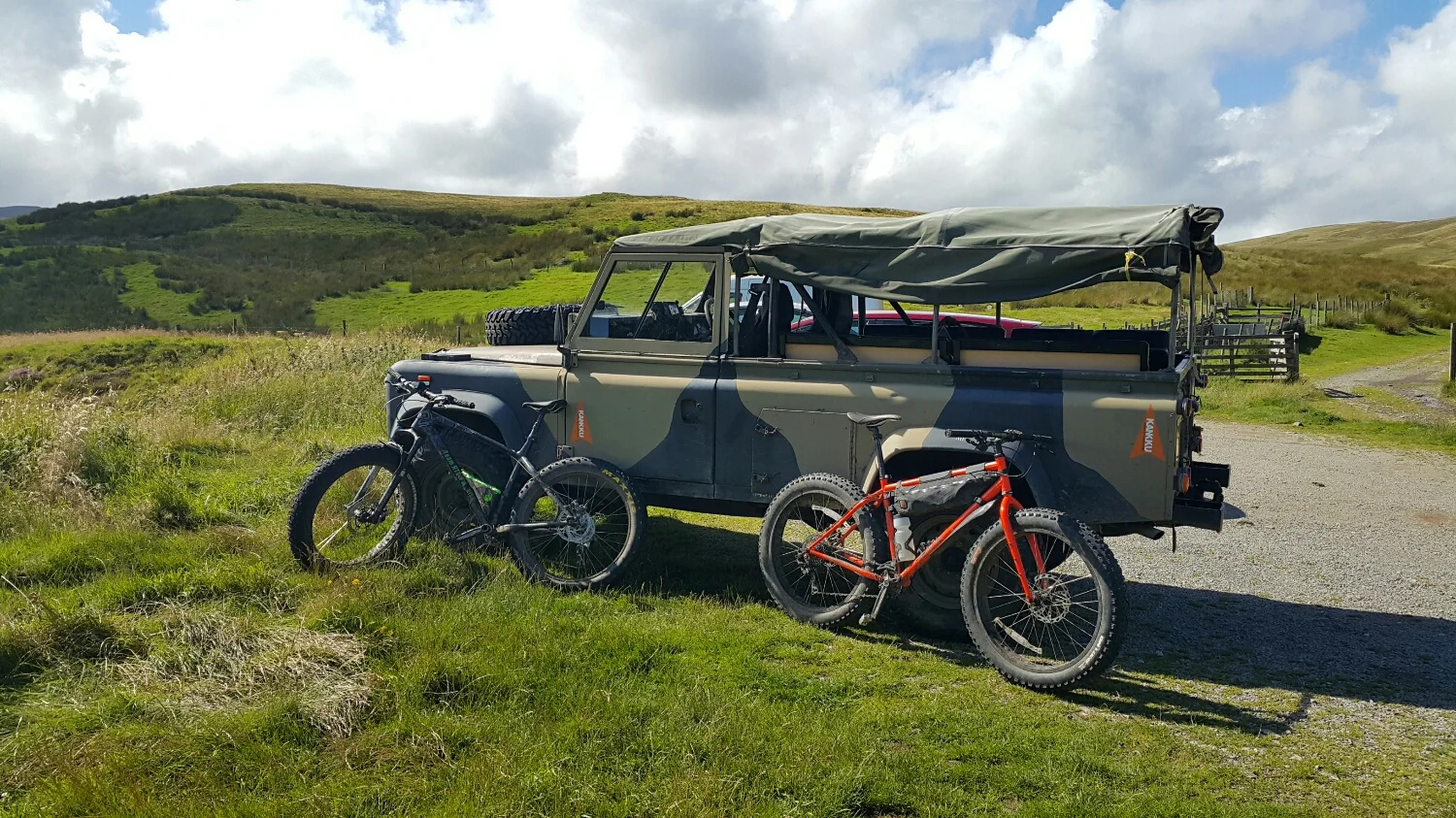 Unloading the bikes, wind is up and moody clouds are wiping thru.