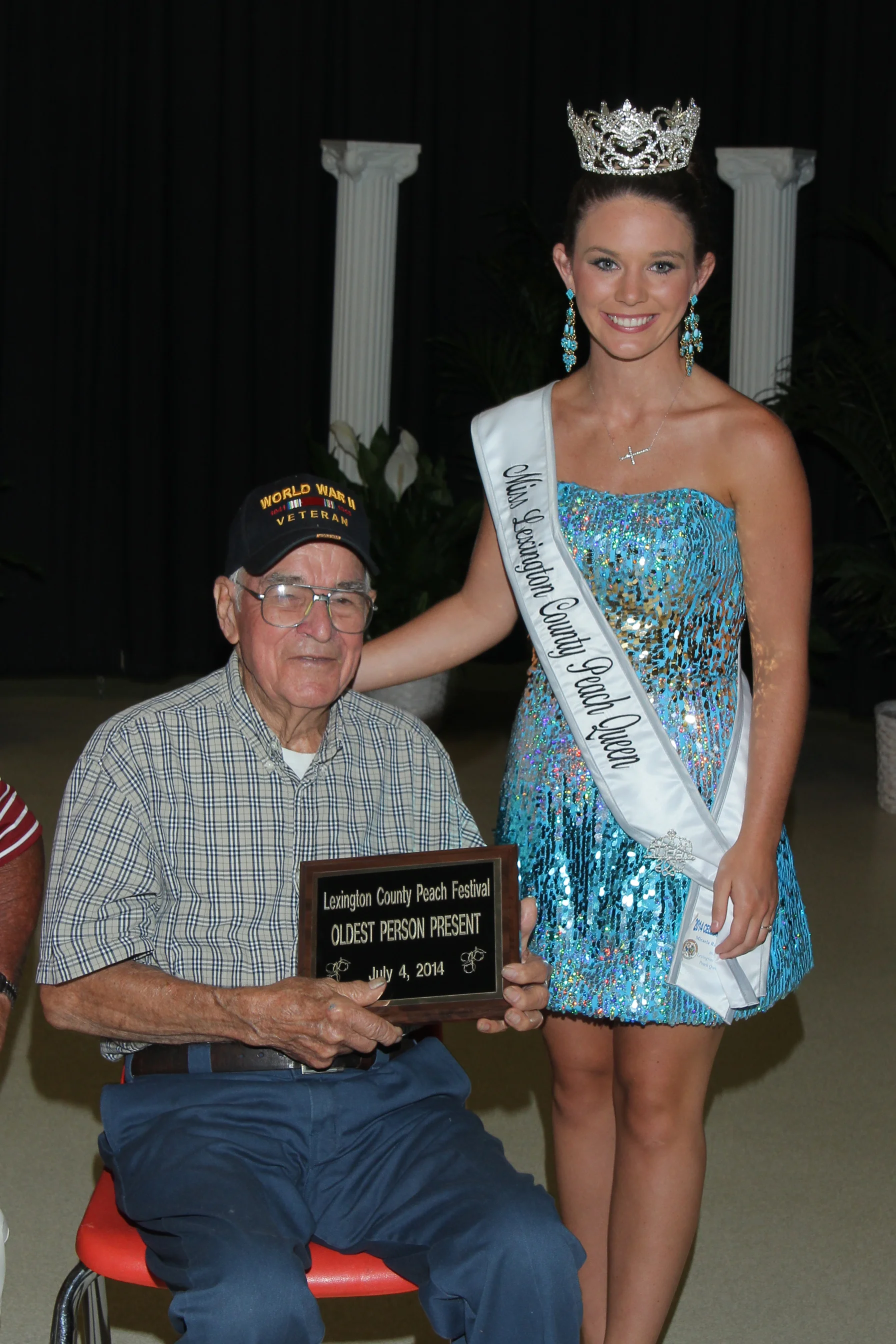 George Oswald, a World War II army veteran and&nbsp;the 2014 Grand Marshal&nbsp;with 2013 Lexington County Peach Queen Micaela Campbell.