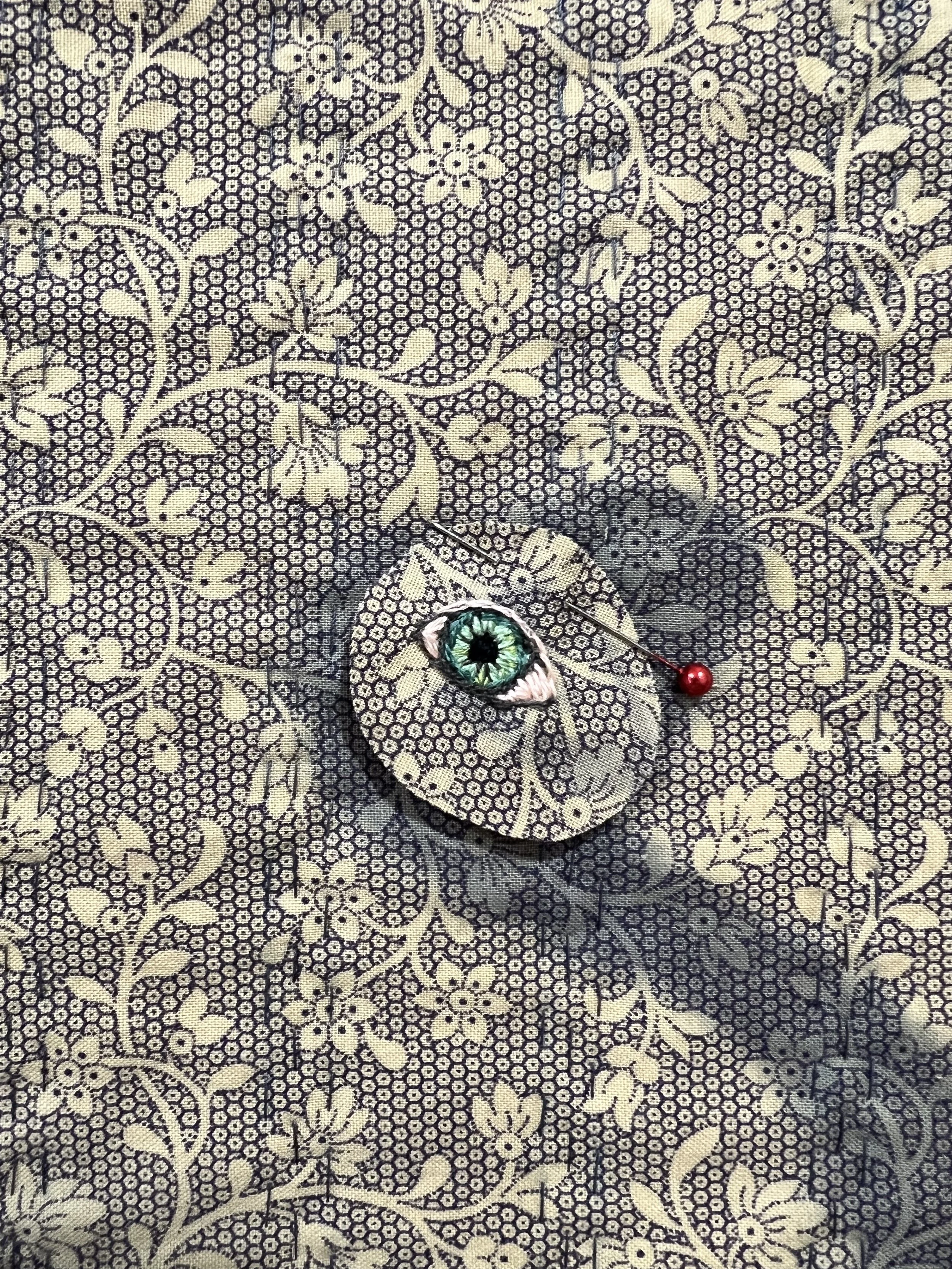 Embroidered and appliqued eye detail