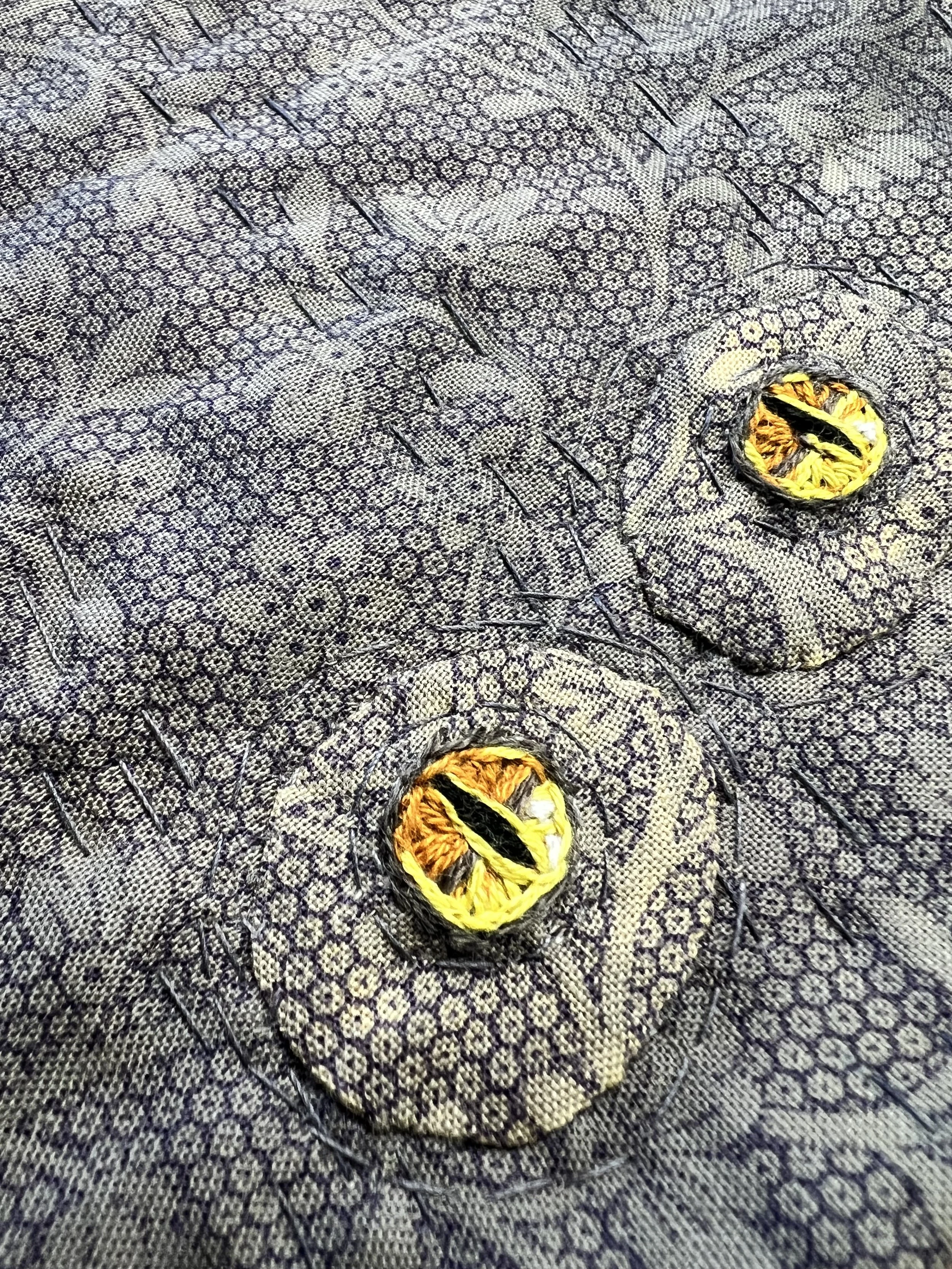 Embroidered and appliqued eye detail