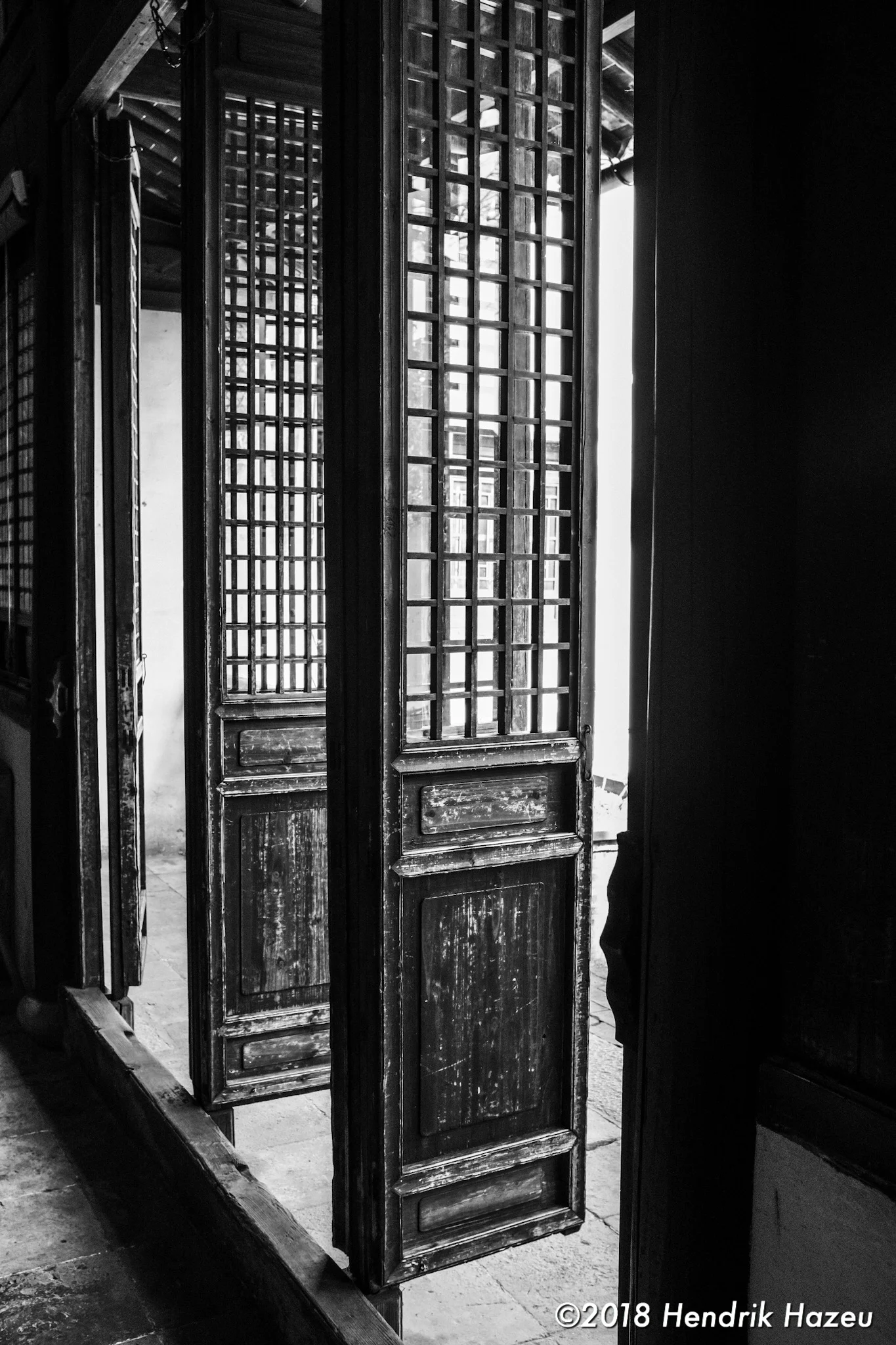 Courtyard doors, Fuji X100F, 23mm f/2 @f/5.6, 1/60sec ISO400 developed in LR CC mobile