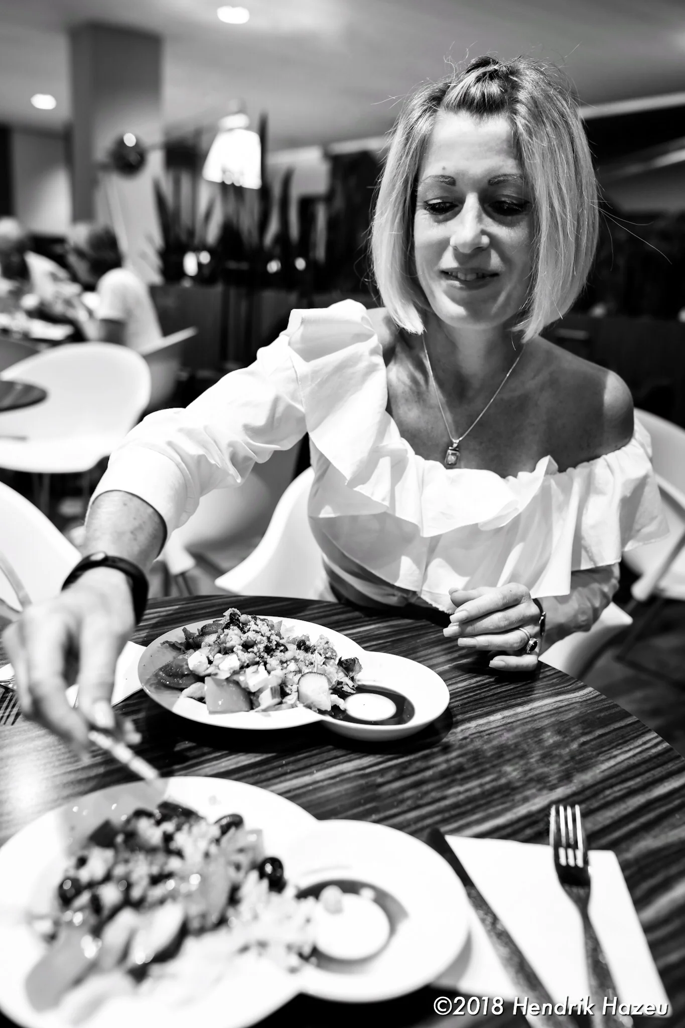 With my pretty wife at the airport, D850 with 28mm f/1.4 @f/2.8, 1/60sec, ISO 450