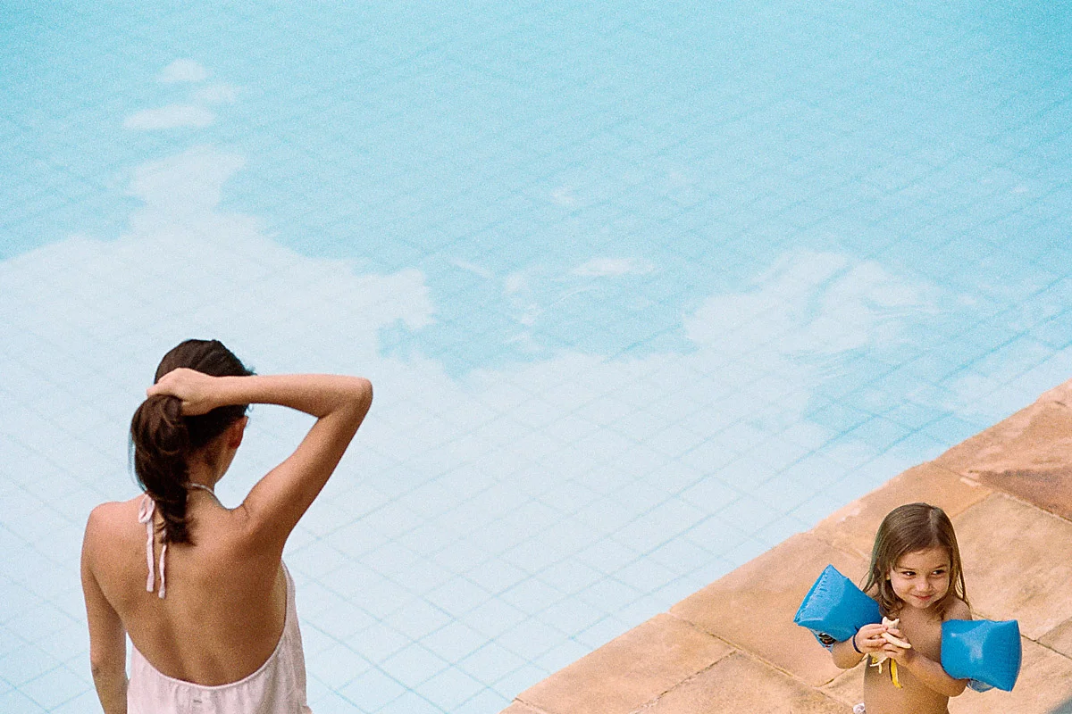 Mum and daughter at the swimming pool, Brazil