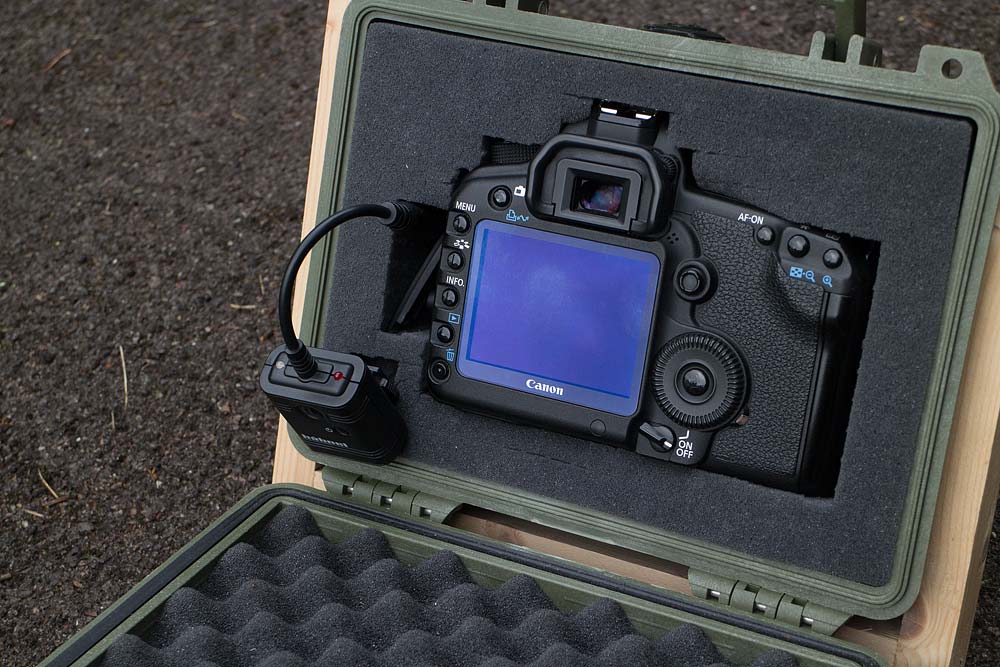 Showing the inside of the box. The foam both holds the camera and muffles noise.