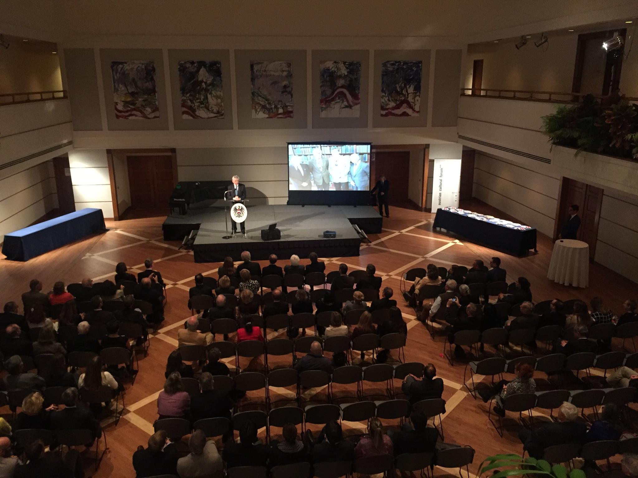 Ambassador Hans Peter Manz welcomes guests to the event.