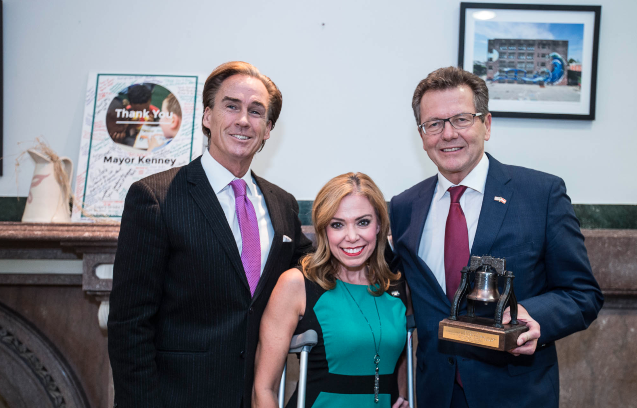 Mike Stack, Lieutenant Governor of the Commonwealth of Pennsylvania, and City Representative Sheila Hess, welcomes Ambassador Waldner with a "Liberty Bell"