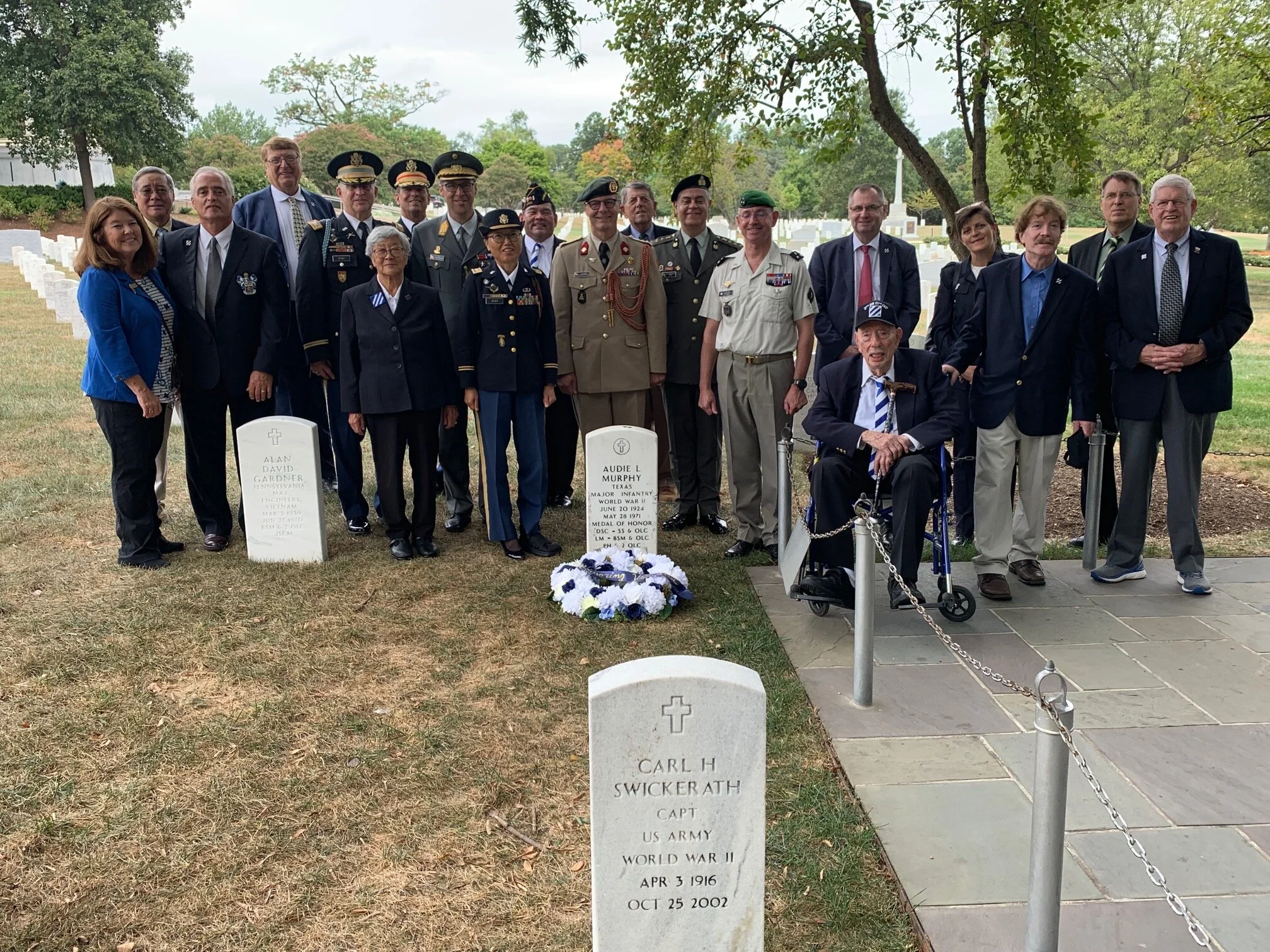  The attendees behind the headstone of Audie Murphy at Arlington National Cemetery. 
