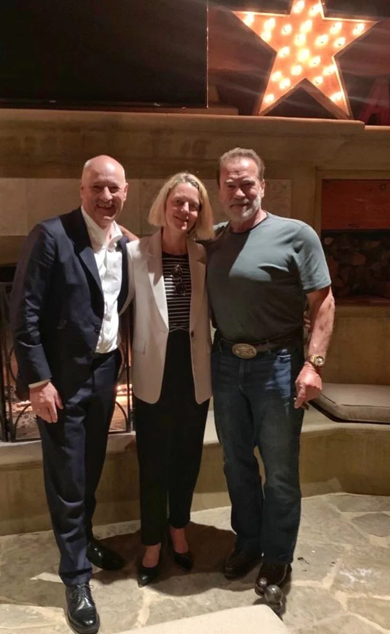 Ambassador Martin Weiss and his wife, Susi Weiss, with former California Governor Arnold Schwarzenegger at the USC Schwarzenegger Institute for State and Global Policy