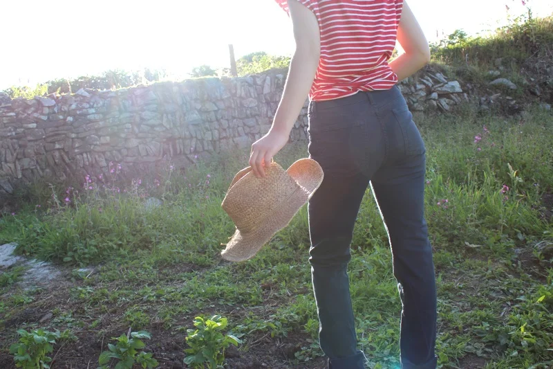 American Apparel Slim Slack Jeans Model Holding Straw Hat.jpg