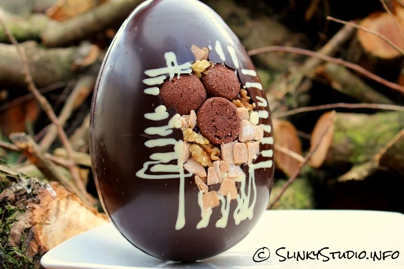 Thorntons Fudge Brownie Easter Egg Front Up Close View on Logs.jpg